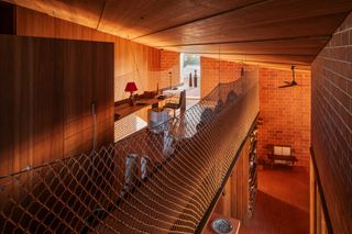 burnt earth beach house workspace room with art