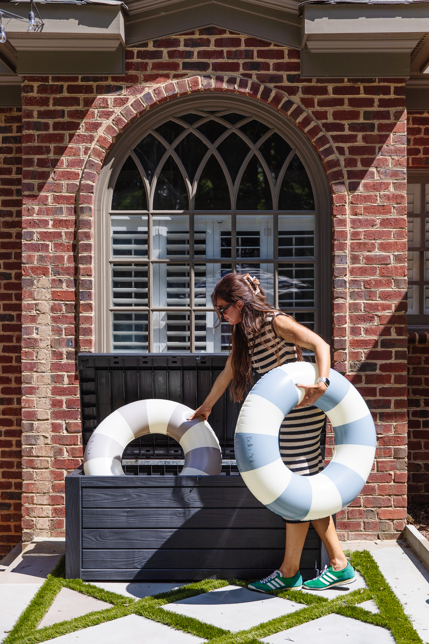 Chris Loves Julia | Julia adding pool inflatables into the deck box