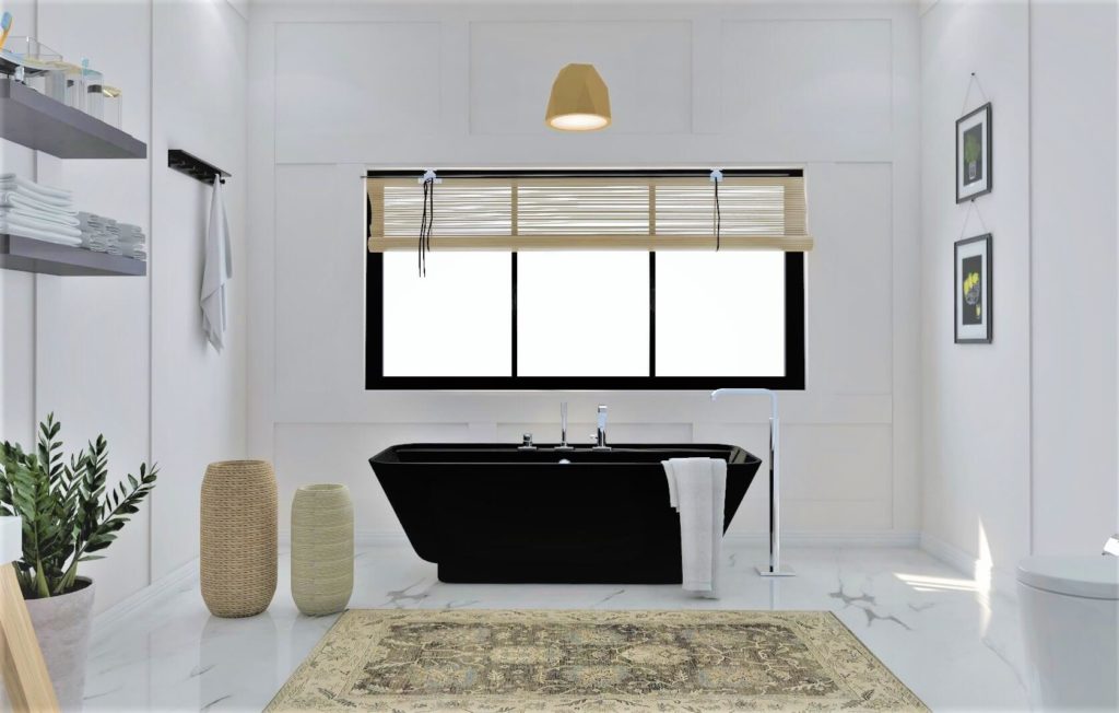 Black bathtub in a bathroom with a large window.