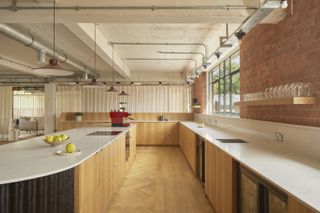 the loom club interiors with timber cladding and soft curtains dividing the space