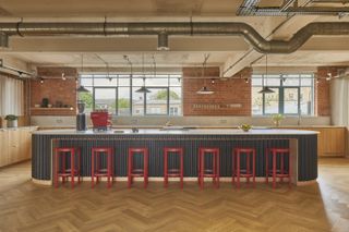 the loom club interiors with timber cladding and soft curtains dividing the space