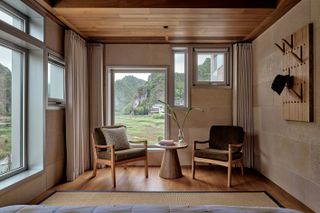 Gong House chair sitting next to window looking out