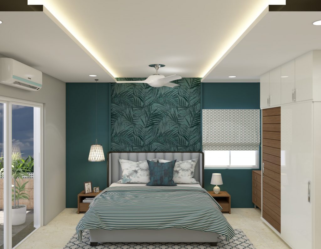 A modern master bedroom with a teal accent wall featuring a tropical leaf pattern