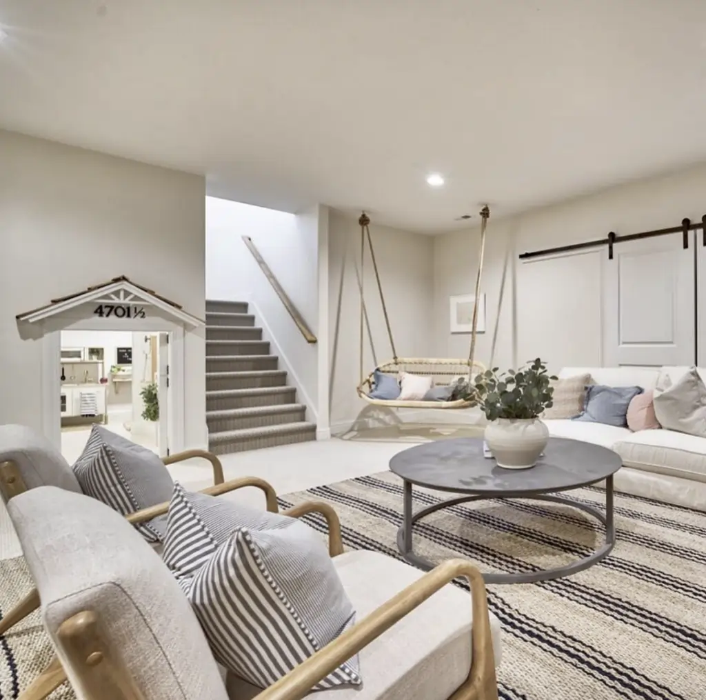 Cozy basement living space with a playhouse entrance