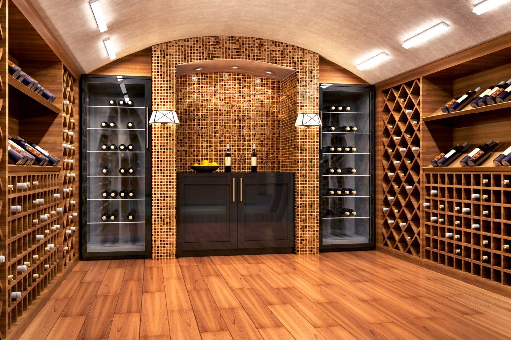 Wine cellar with wooden racks and shelves filled with wine bottles.