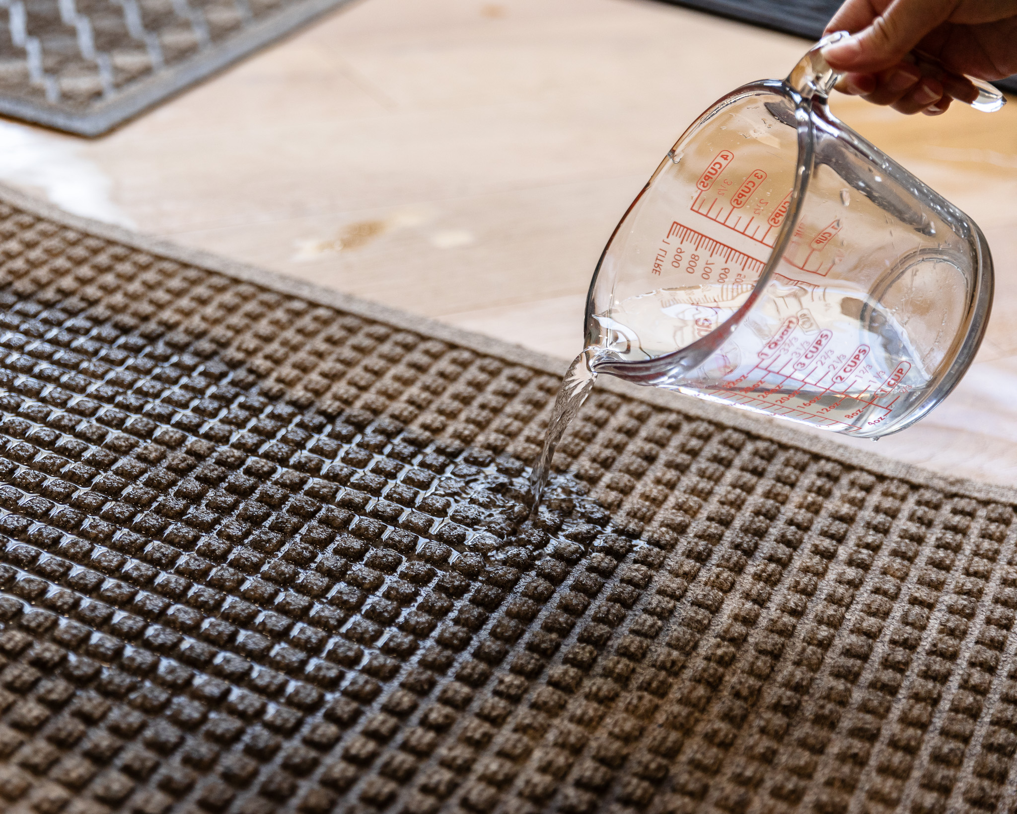 Chris Loves Julia | Pouring water onto a waterproof mat
