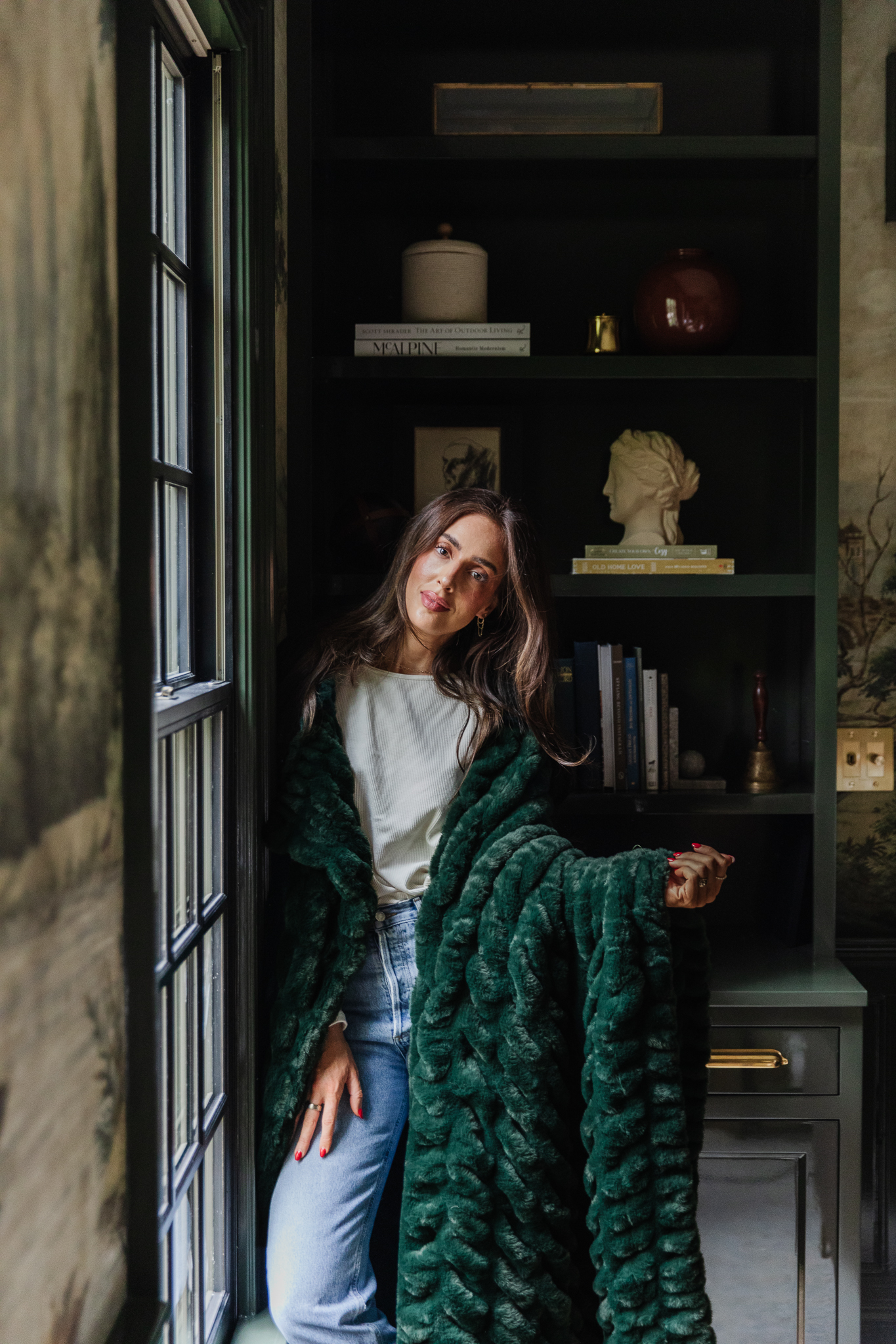 Chris Loves Julia | Julia holding the new CLJ x Lola Blankets color Juniper