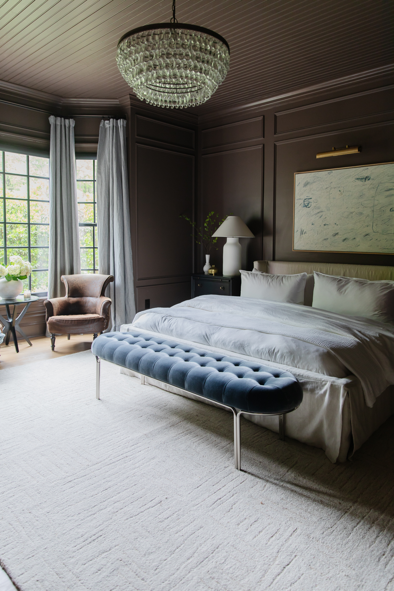 Dark brown bedroom with cream rug