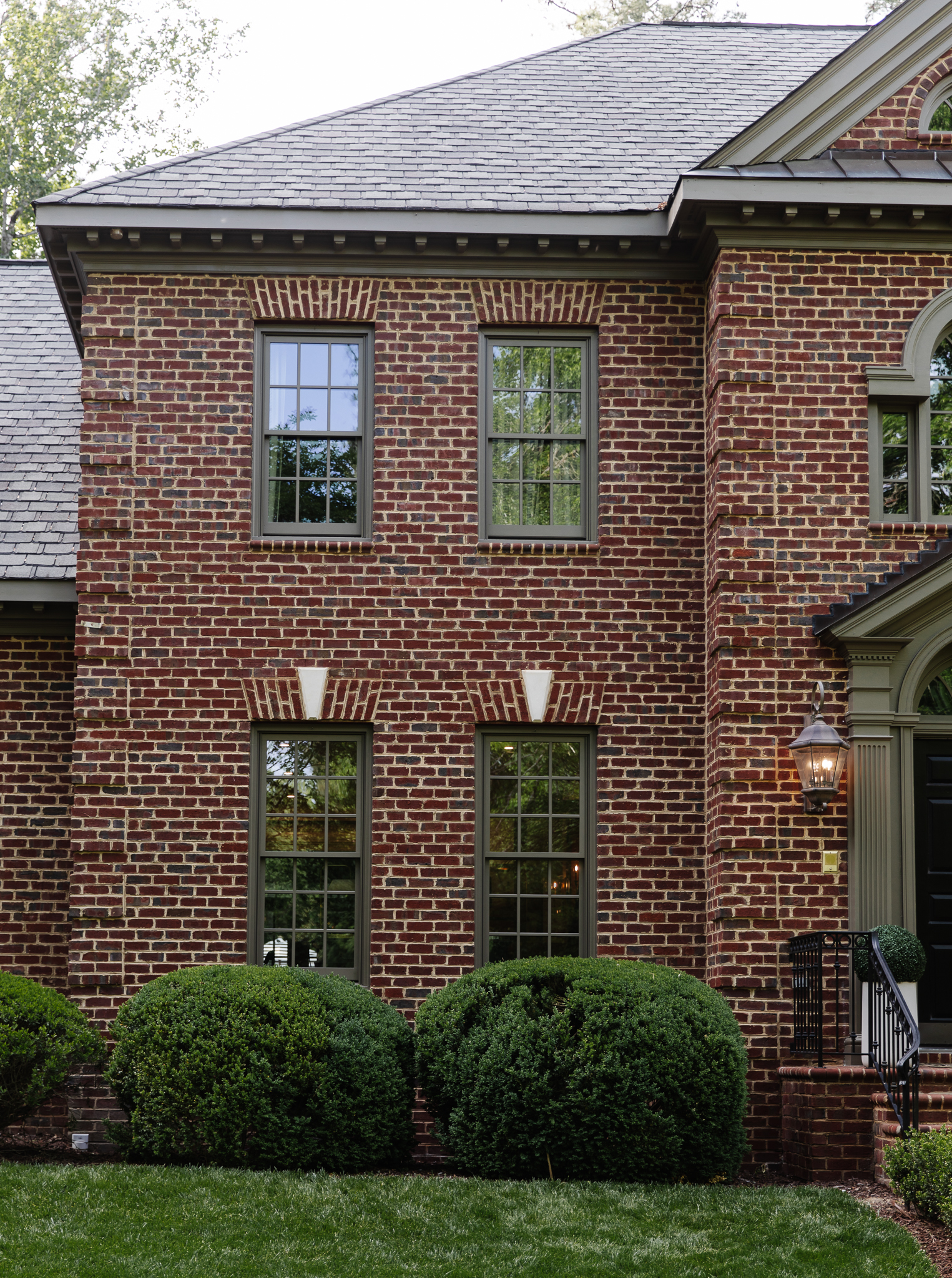 Brick home with dark trim windows