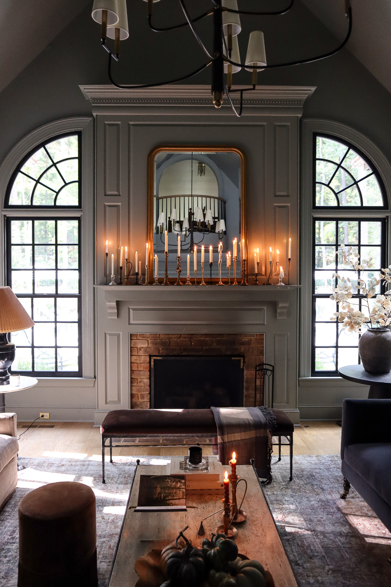 Moody dark living room with candles on the mantle