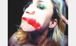 woman's face squashed against glass