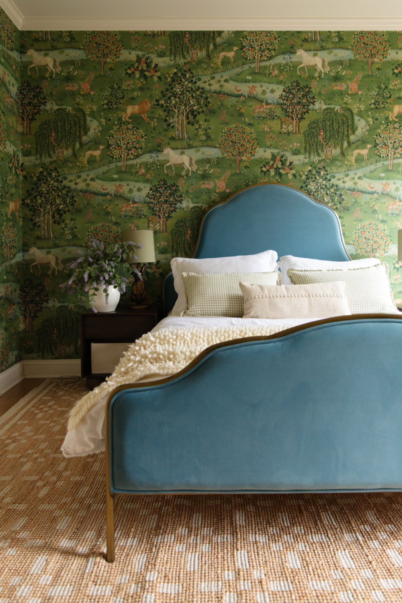 Little girl's room with soft blue velvet bed frame and white & tan jute rug