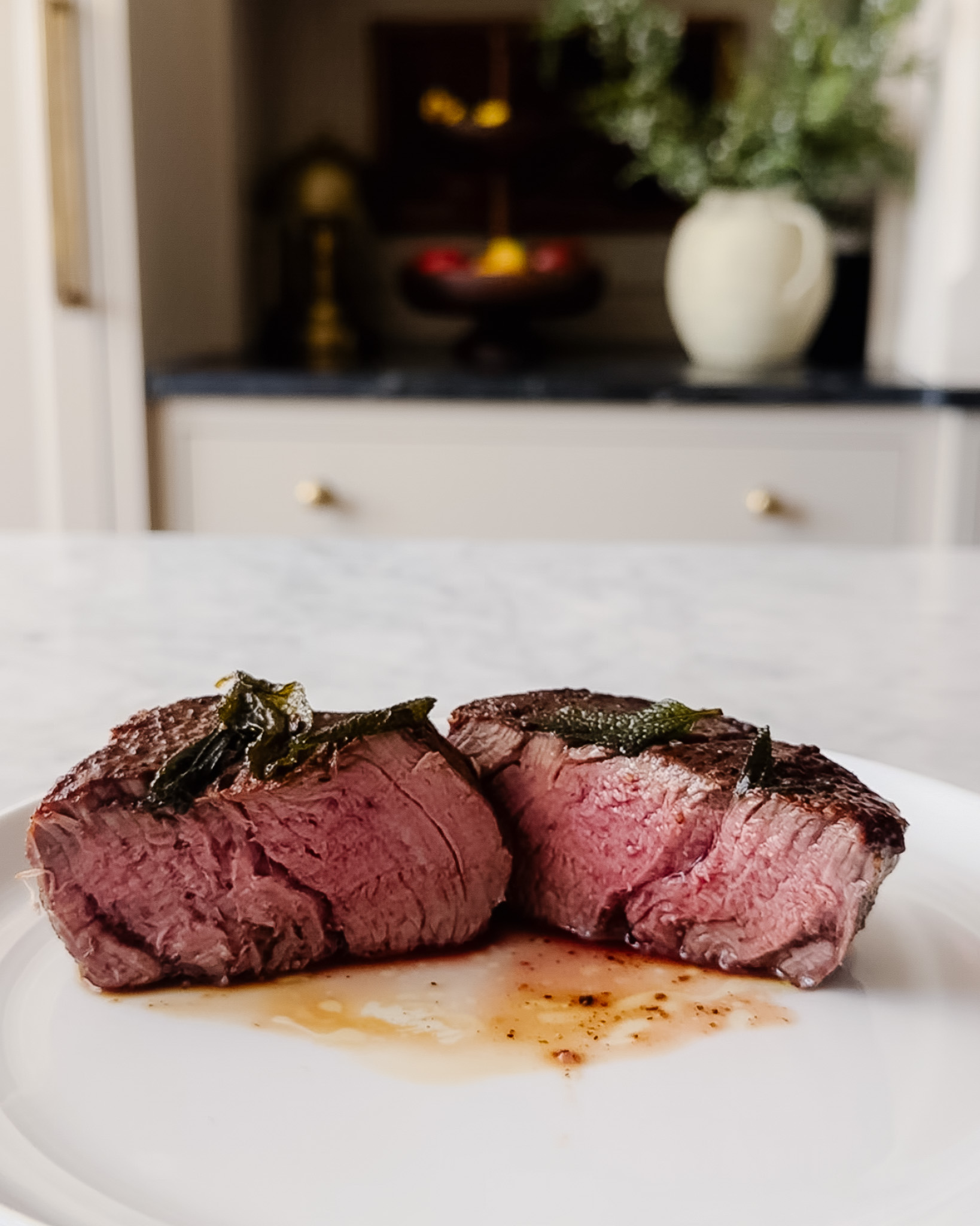 A filet mignon cooked to medium-rare on the stovetop