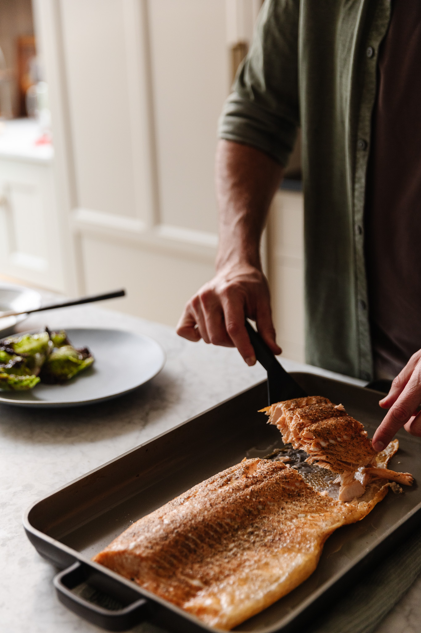 Chris dishing out a portion of roasted salmon