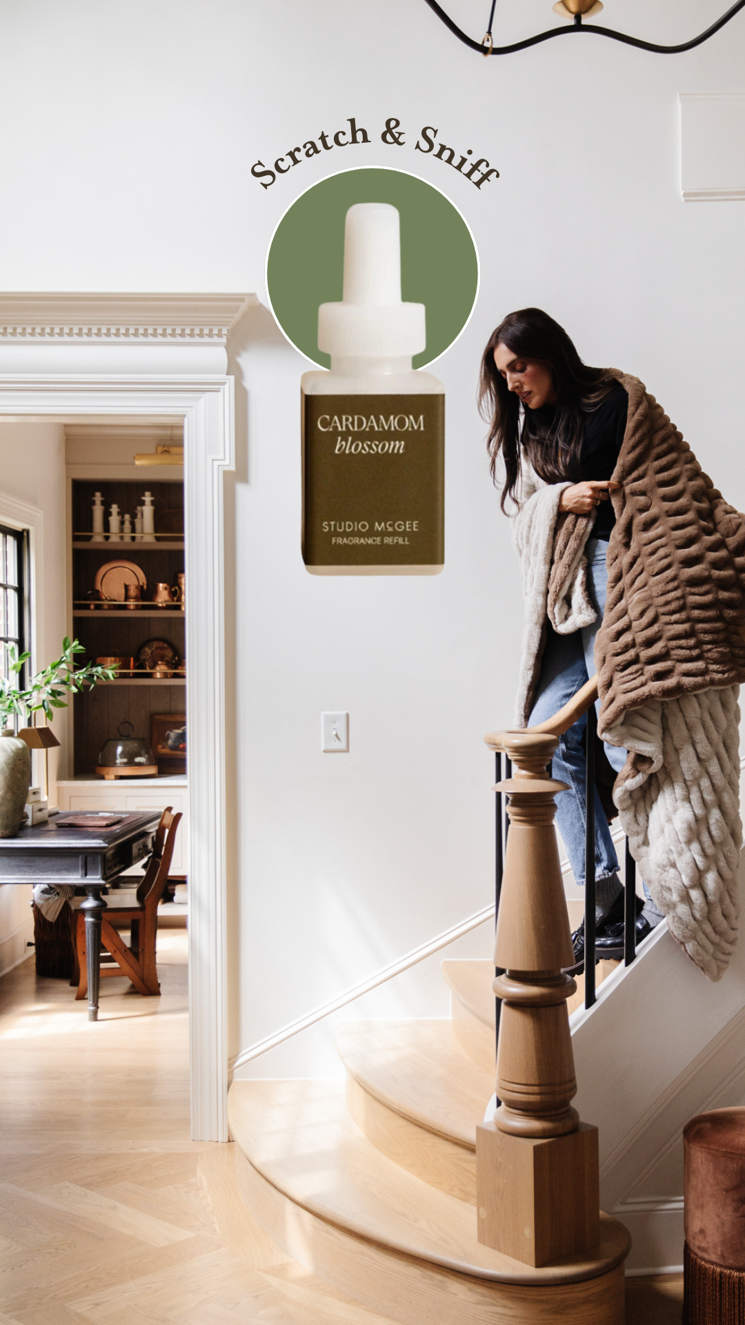 Julia walking down the stairs in her entryway with a superimposed Pura fragrance bottle: Scratch & Sniff Studio McGee's Cardamom Blossom