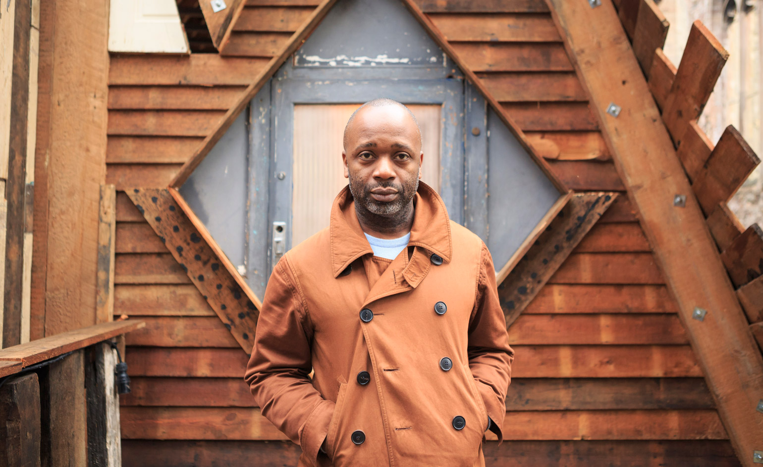 The artist standing in front of the structure