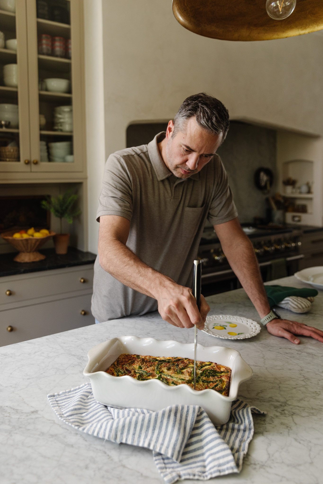 Chris checking the temperature of the frittata