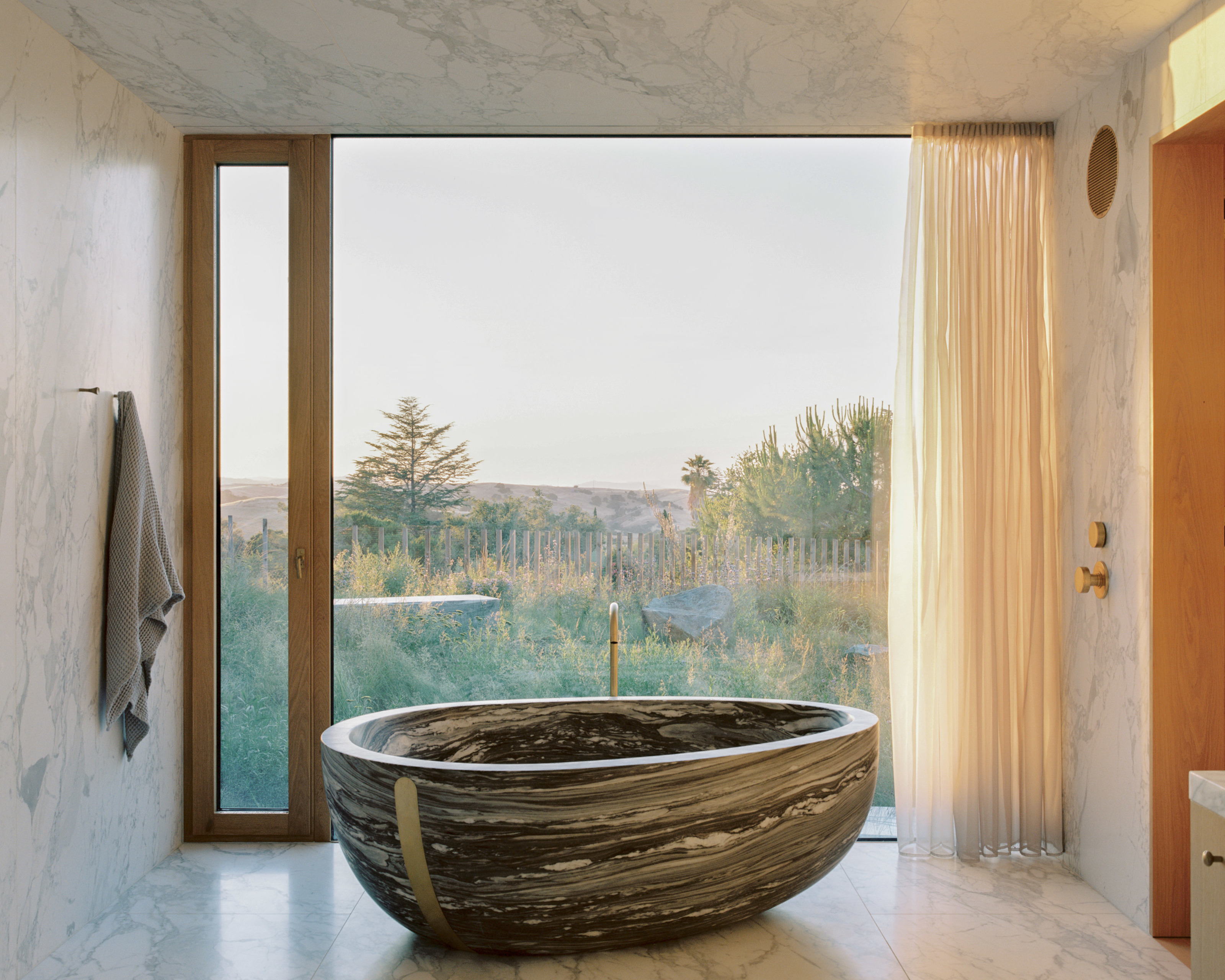 The stone bath in the primary bathroom