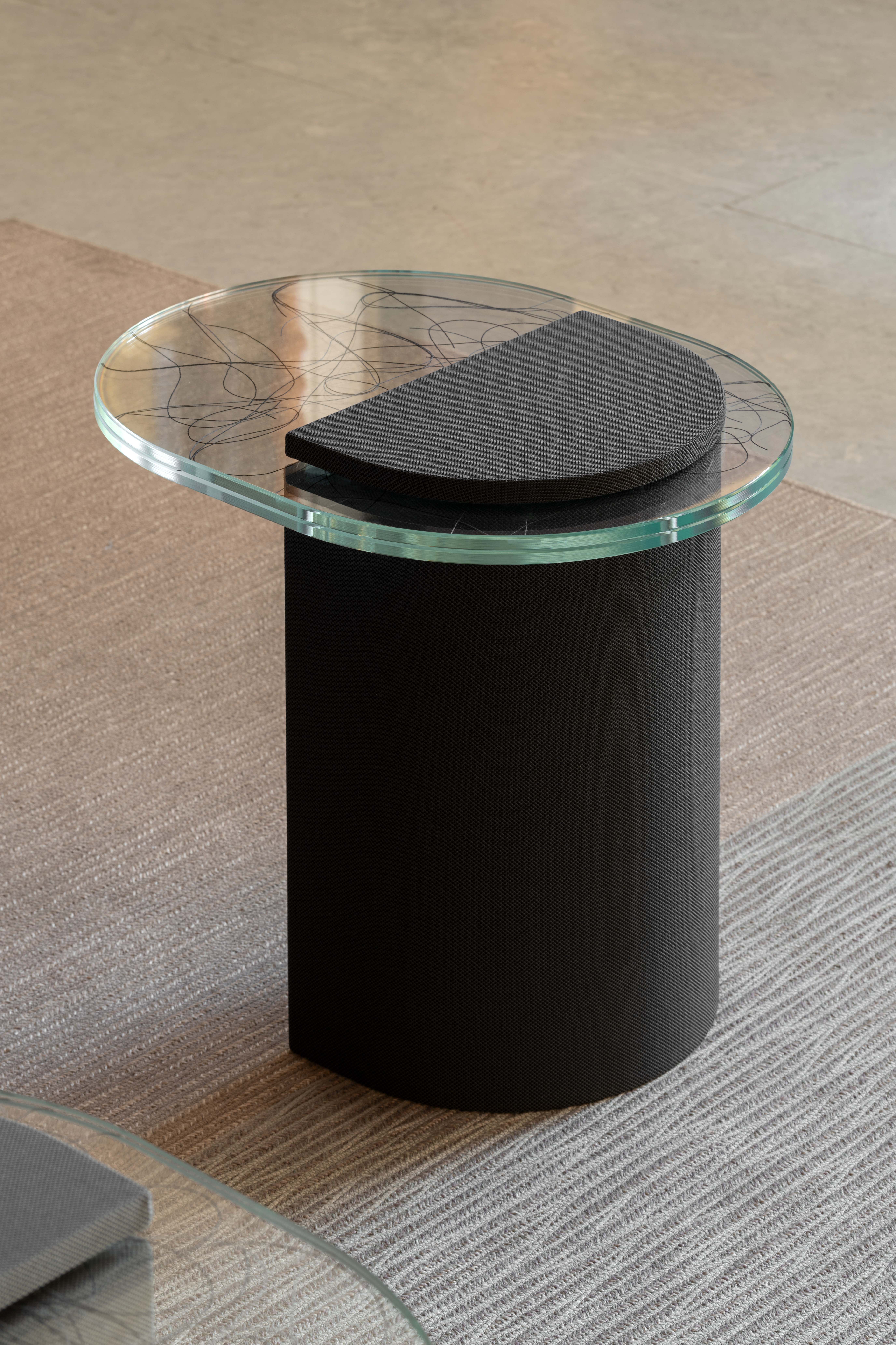 table made using black textiles and glass