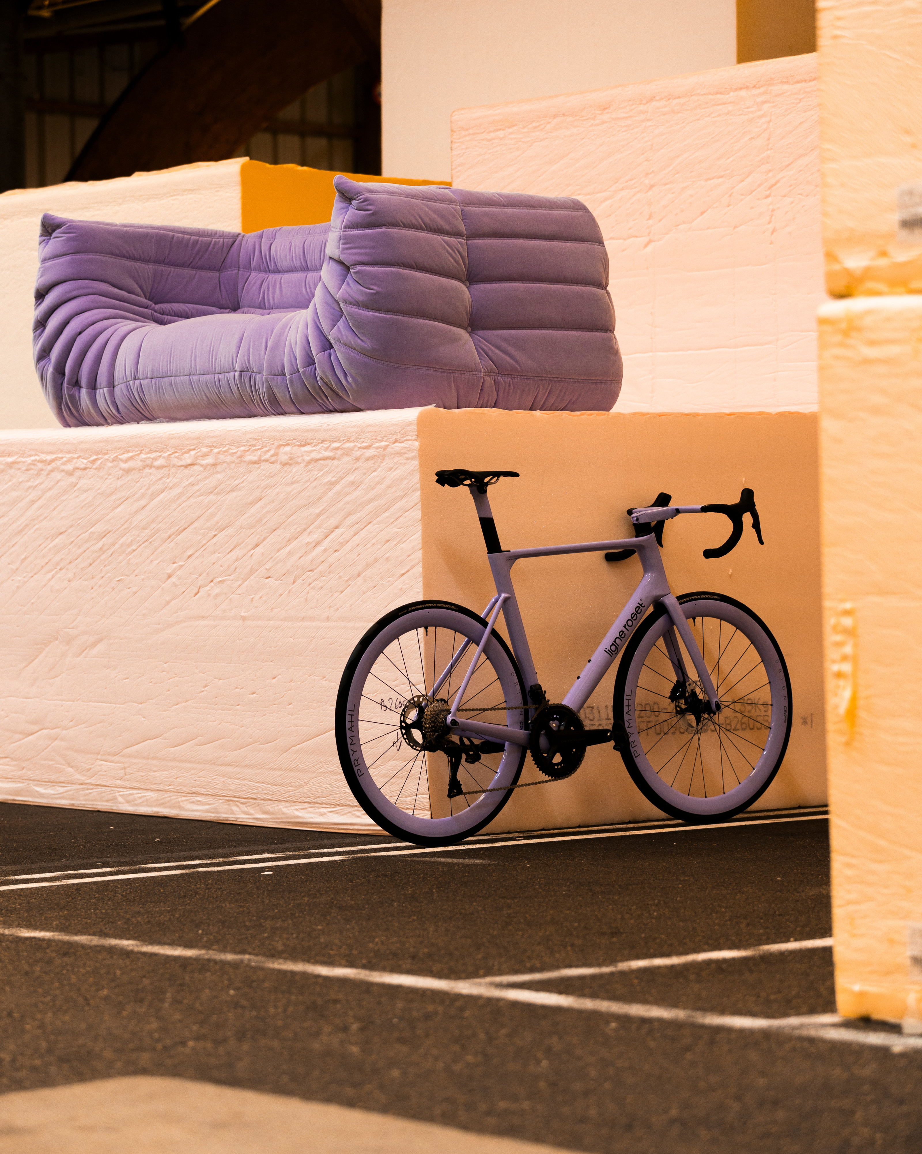 Ligne Roset x Origine Fraxion GTR bike and Togo sofa