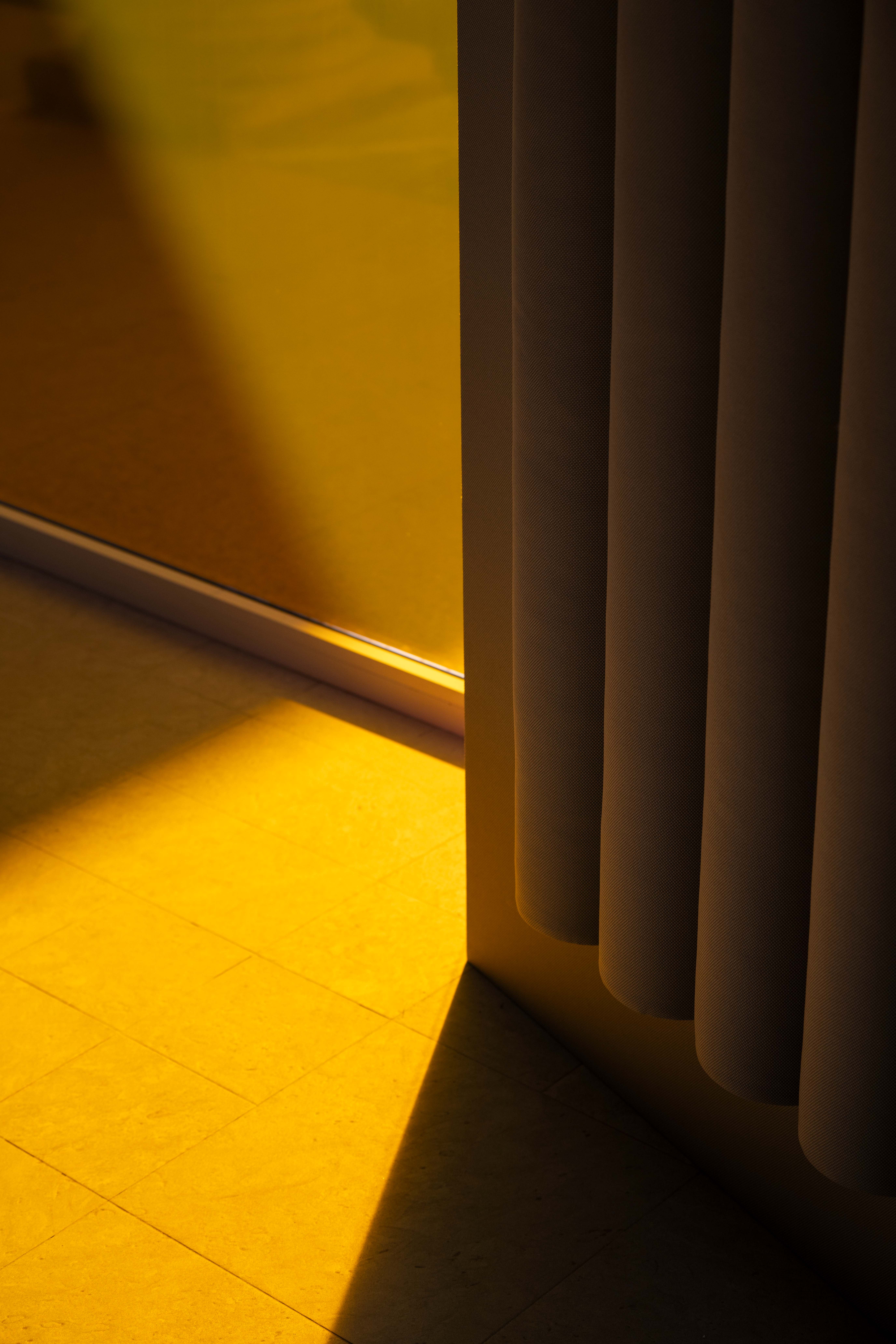 Abstract shapes and shadows made using colourful textiles and glass