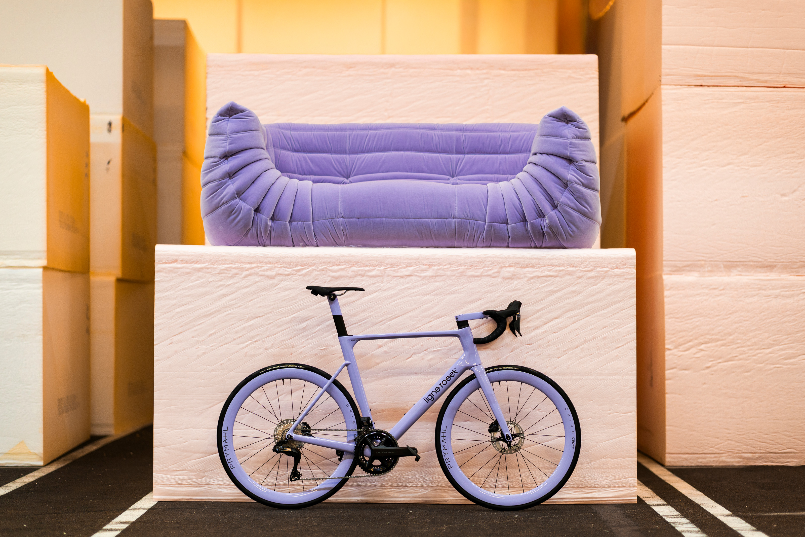 Ligne Roset x Origine Fraxion GTR bike and Togo sofa
