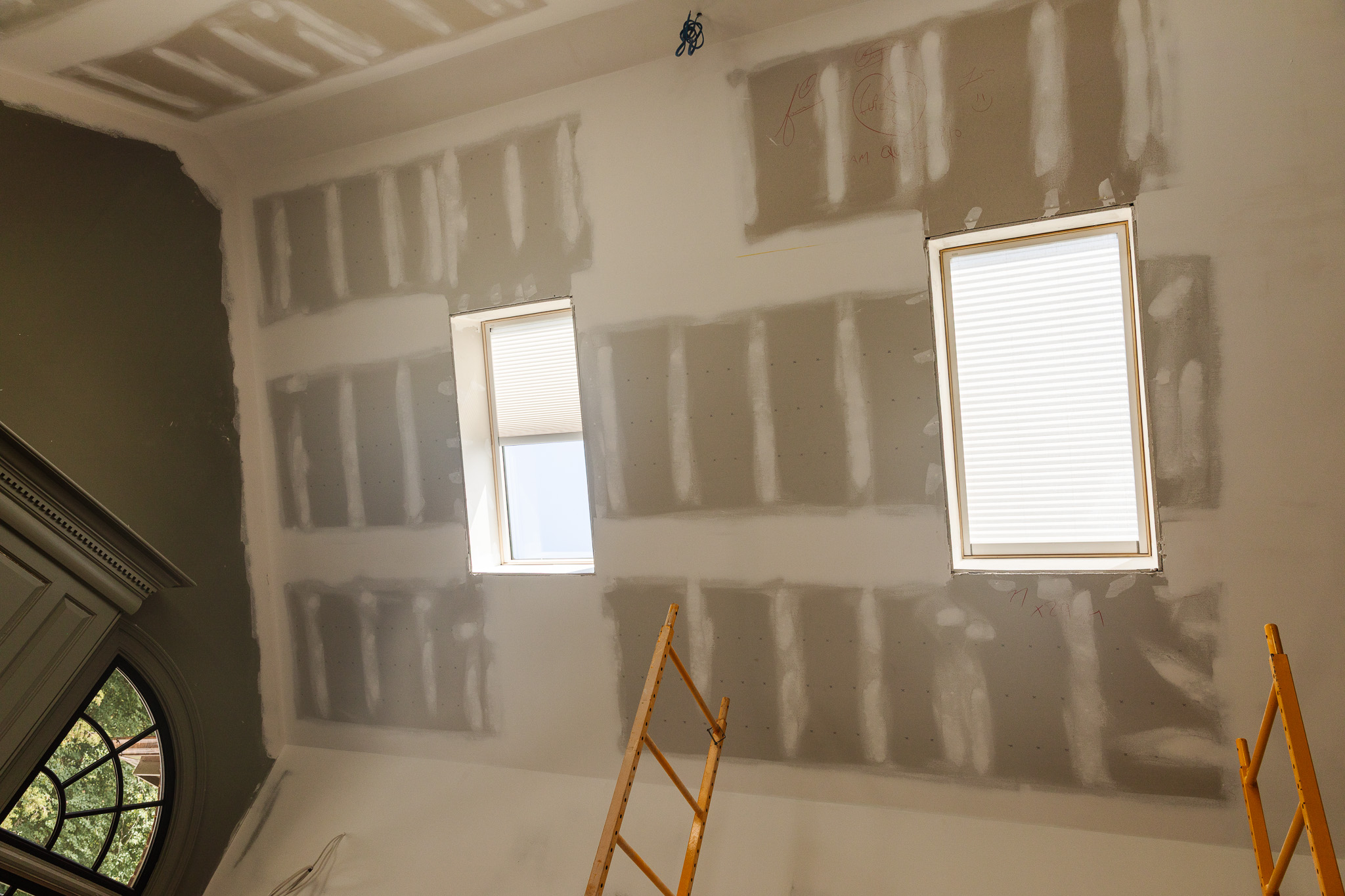 A view looking up at the in-process ceiling with the new skylights