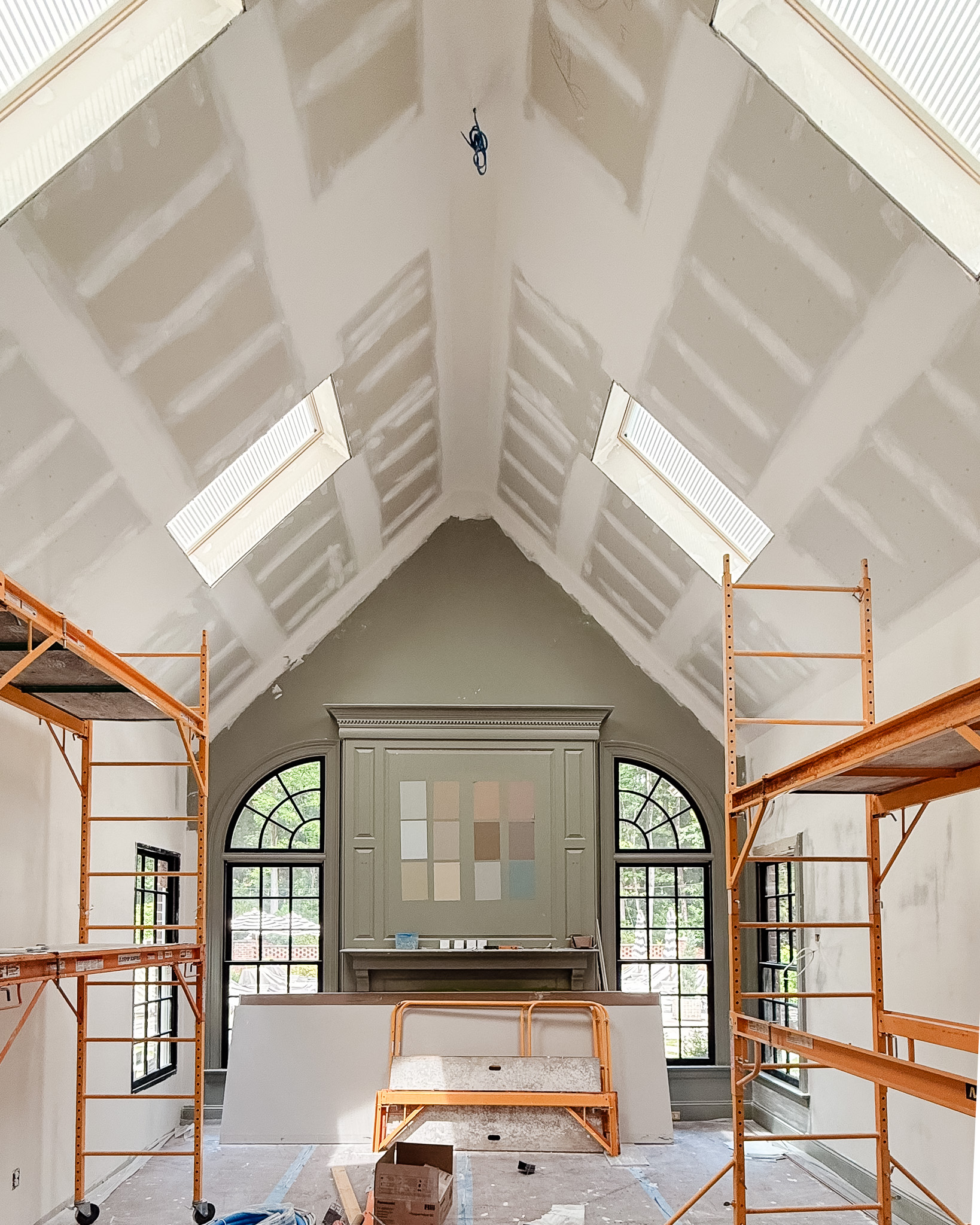 The living room with scaffolding during skylight installation