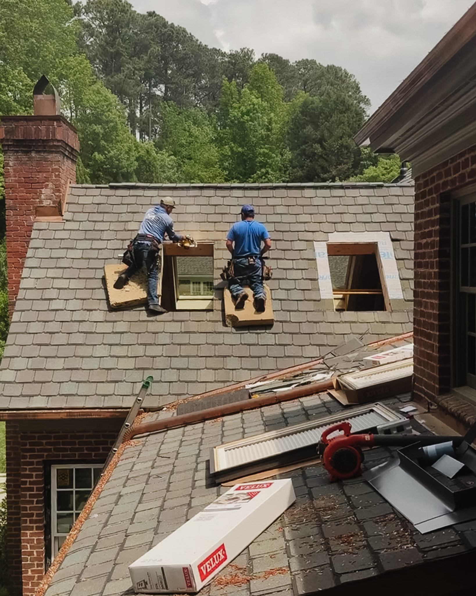 Workers on the roof installing the skylights