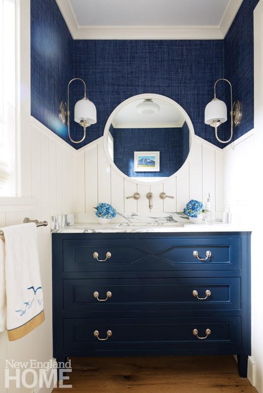 Navy powder room with white shiplap
