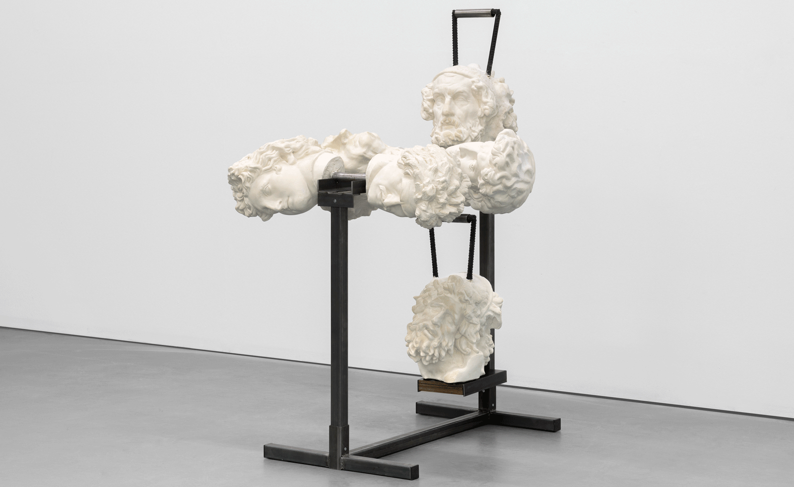 statue on black plinth