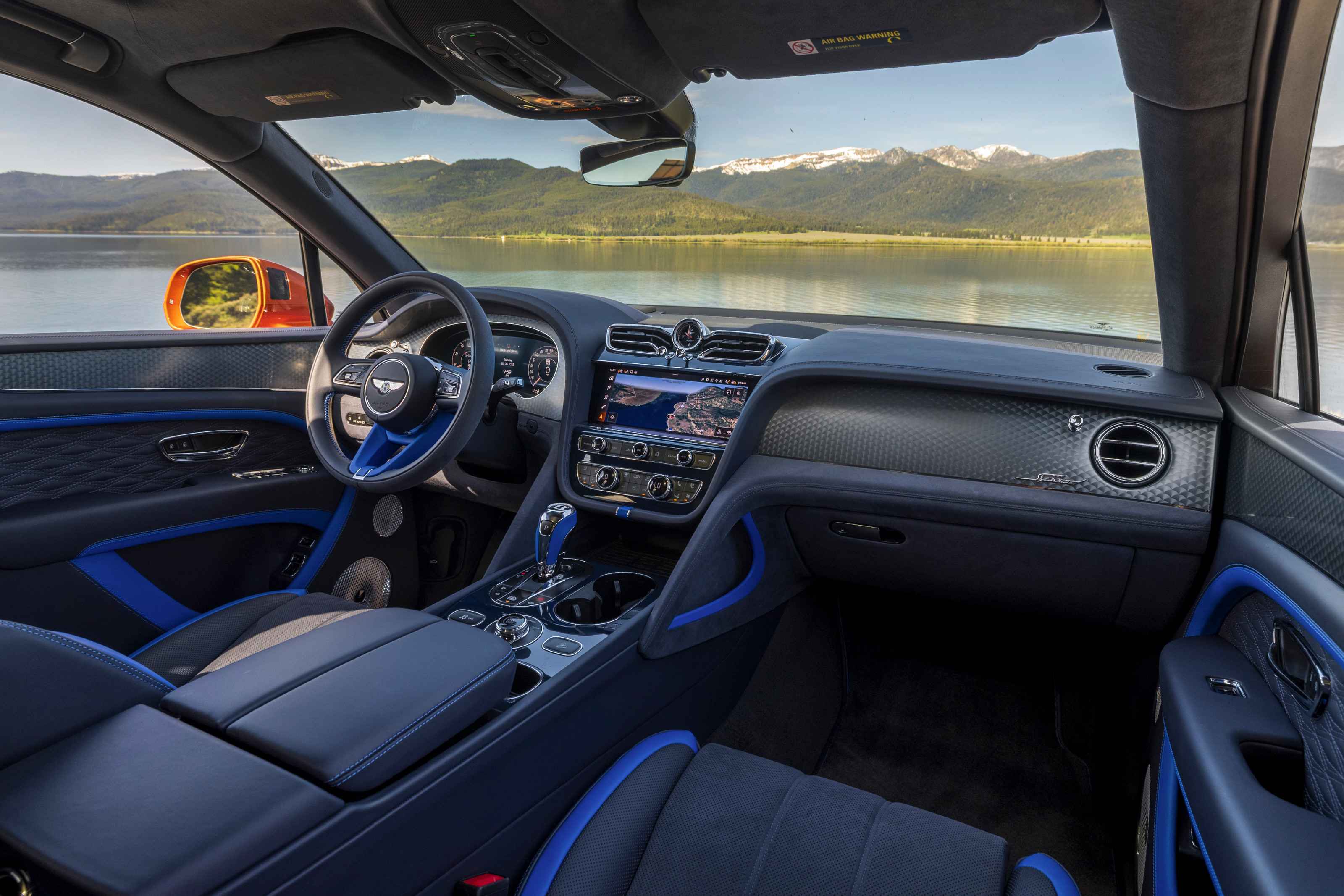 Bentley Bentayga Speed in Orange Flame, offset with blue interior trim