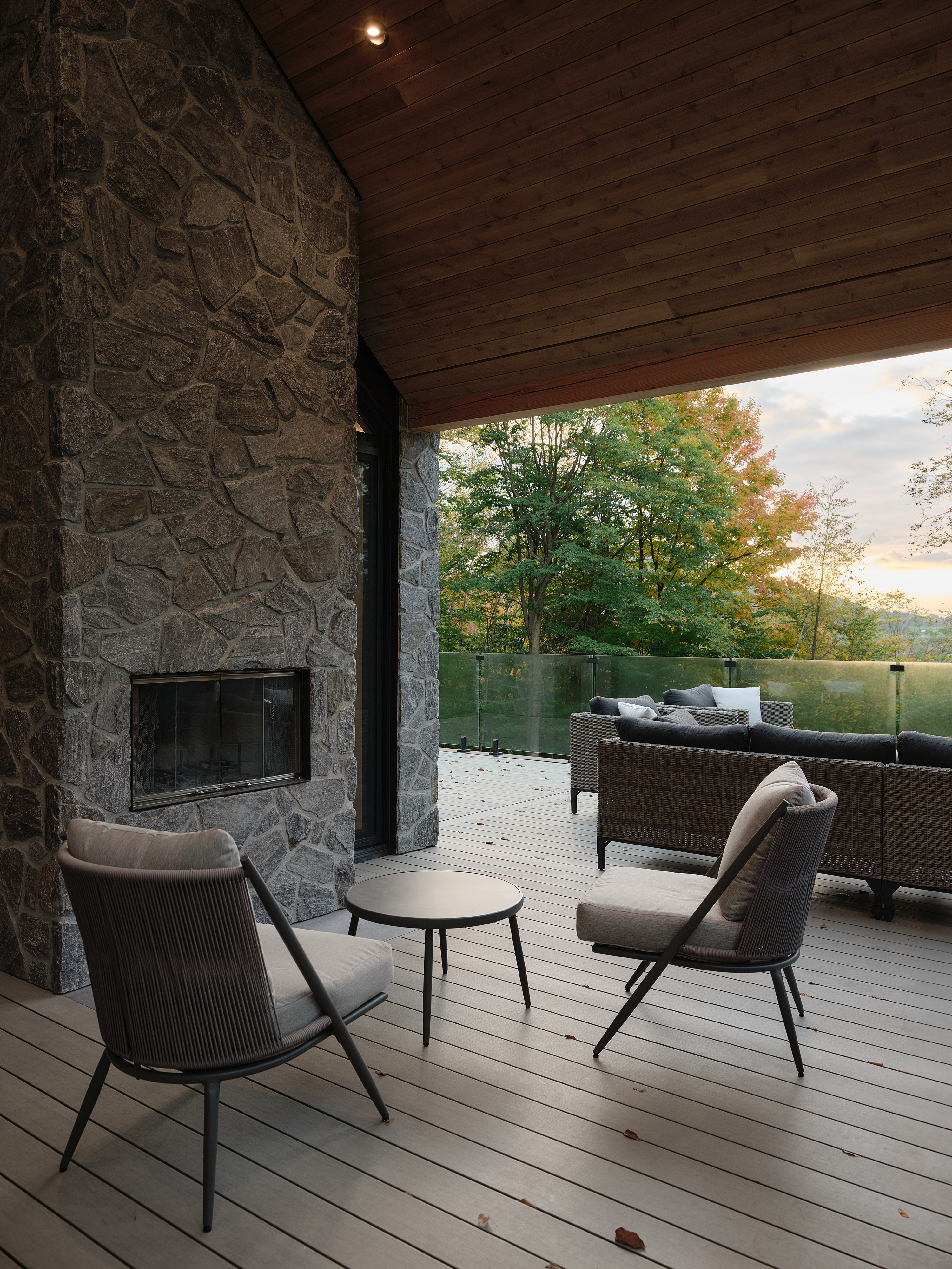 An external living space and terrace is set under the pitched roof