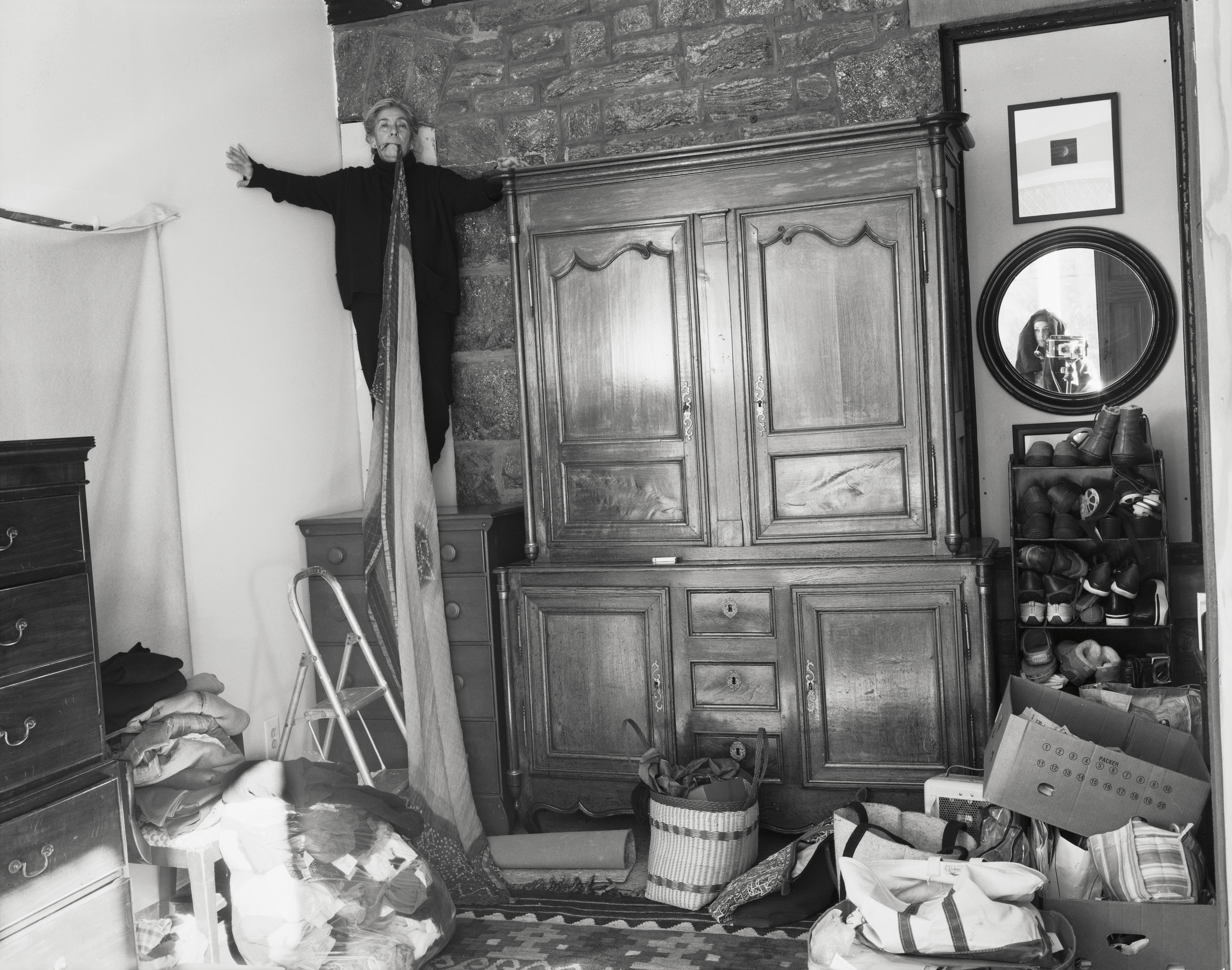 black and white images of an elderly woman in her house