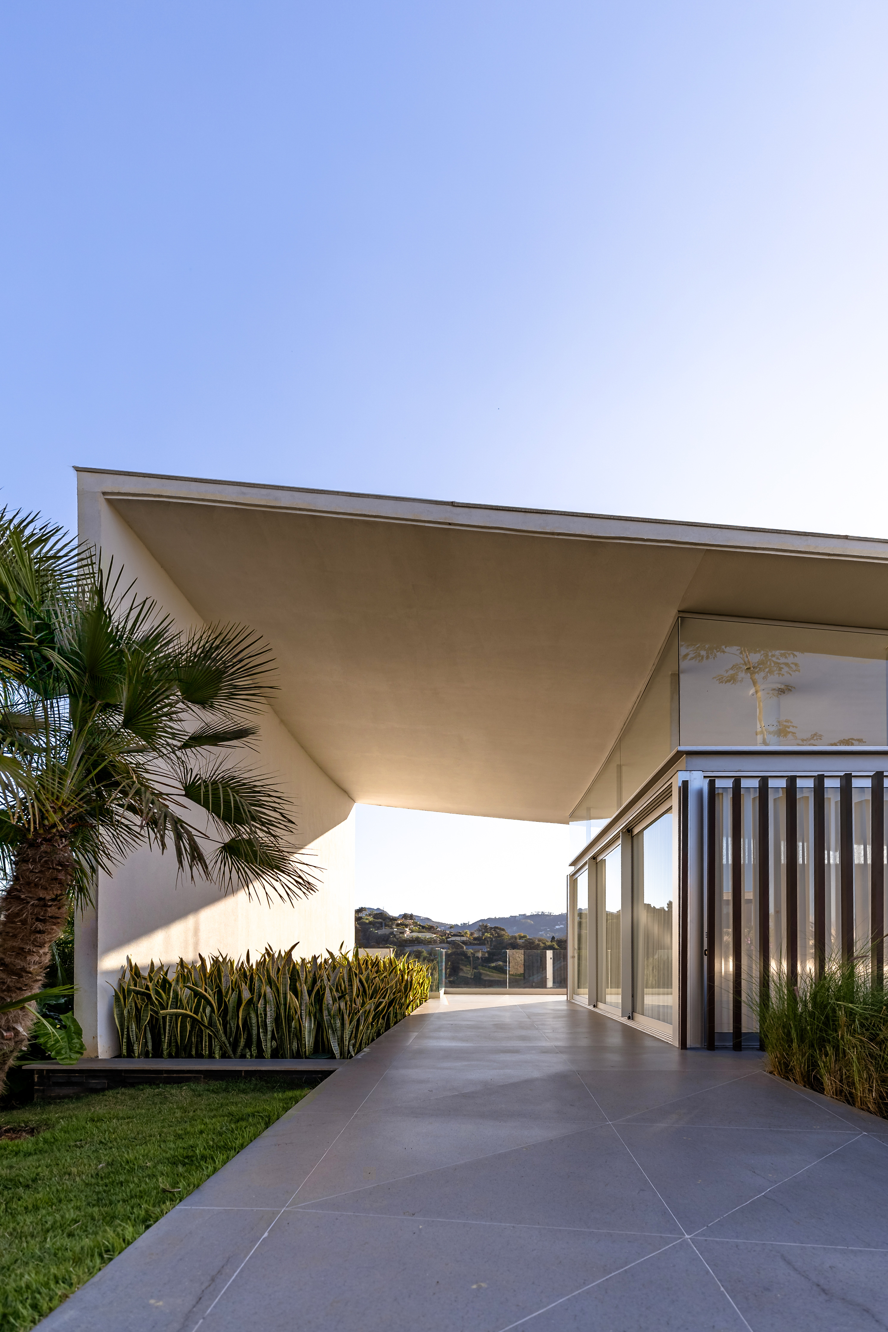 The roof oversails the built area to create a covered terrace
