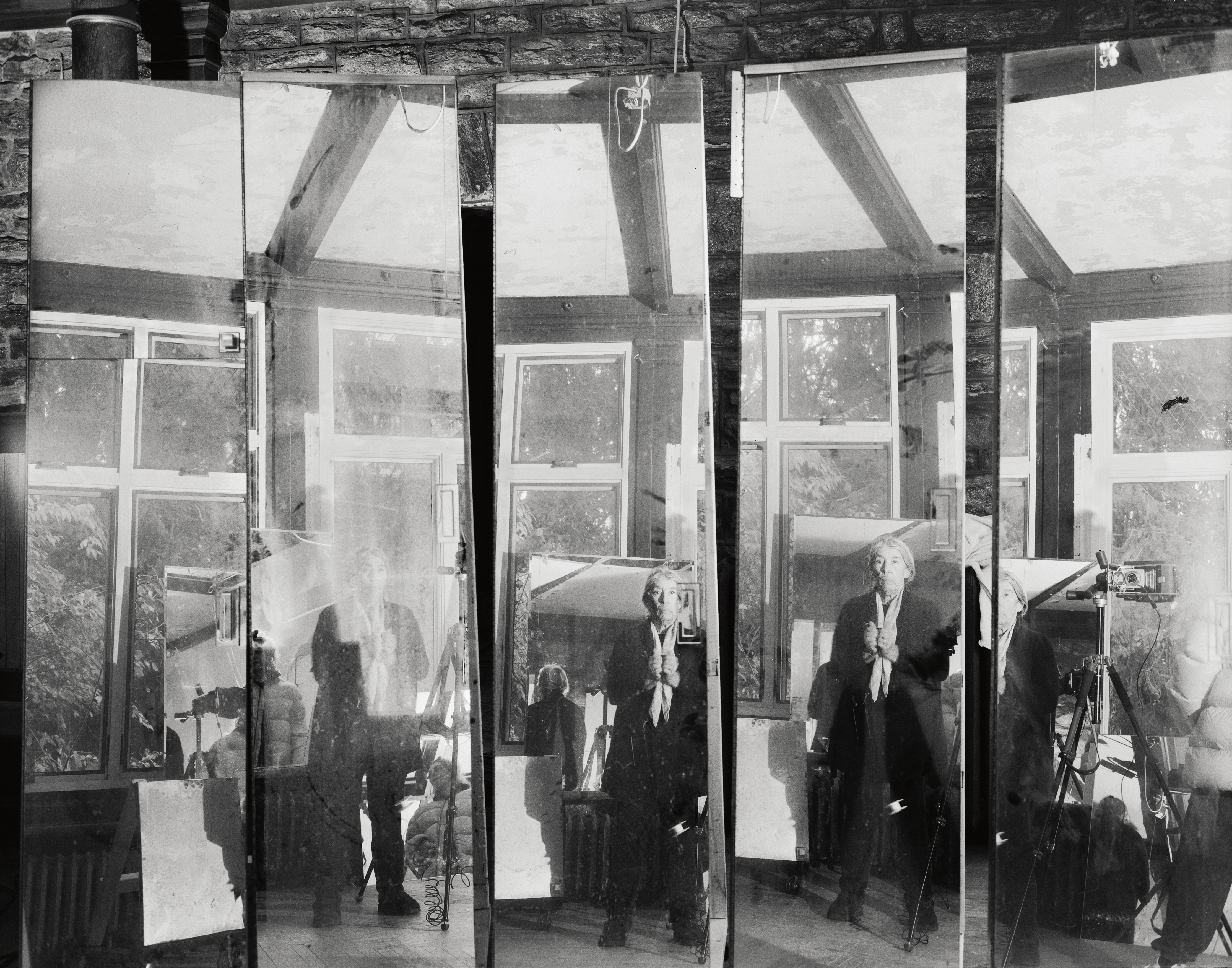 black and white images of an elderly woman in her house