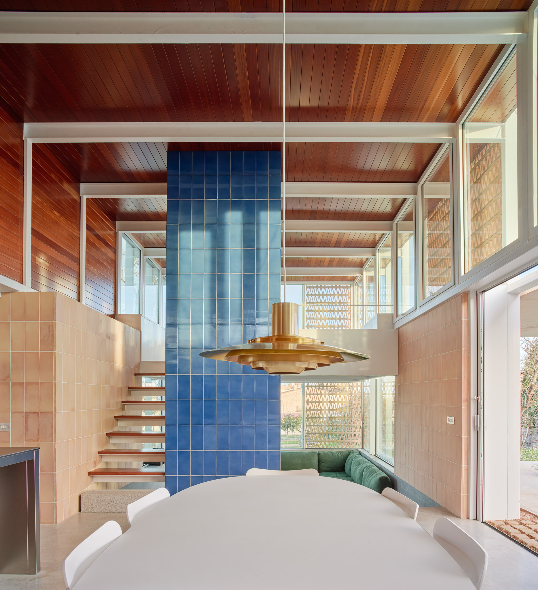 A mezzanine level sits above the seating area in the main pavilion