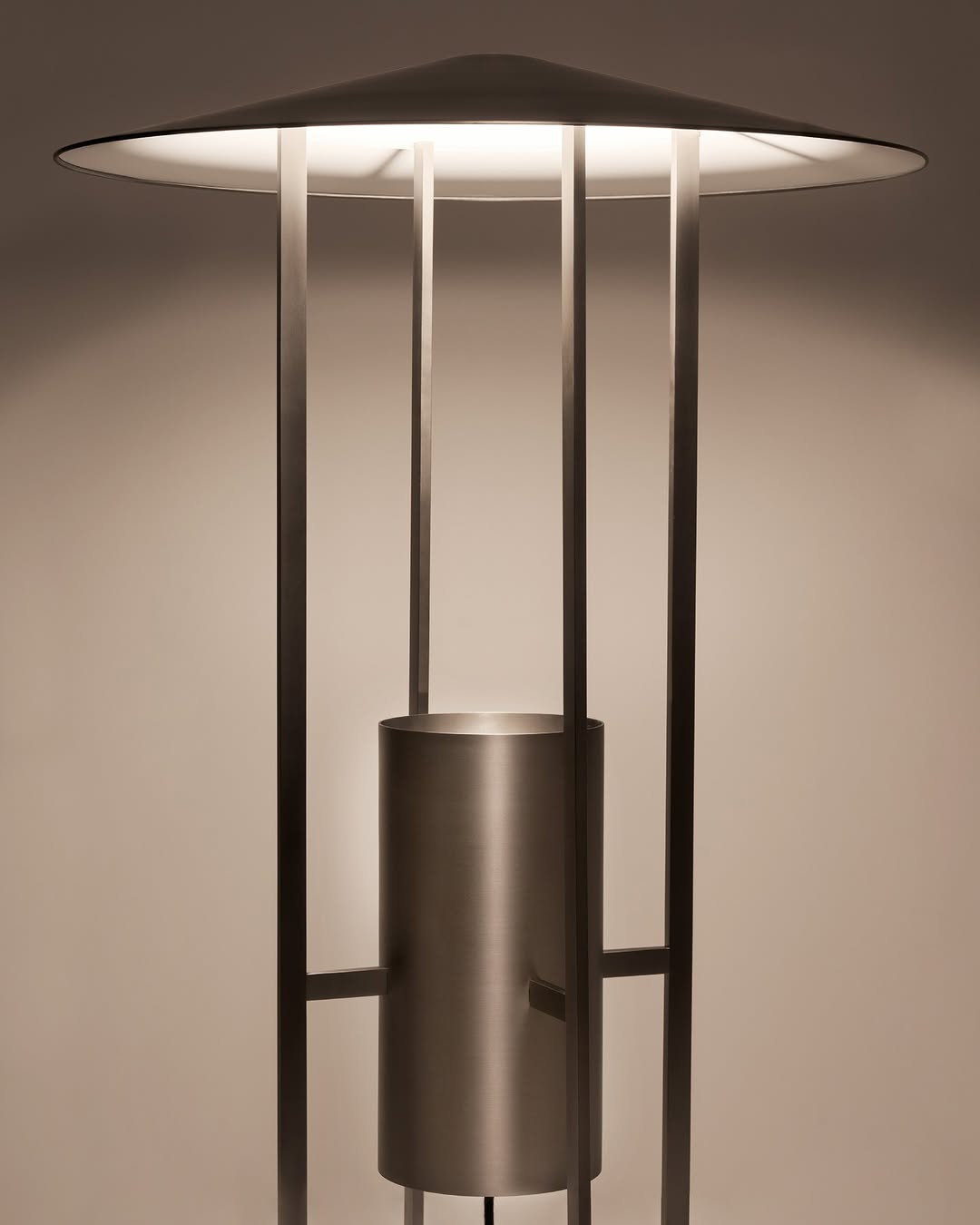 Metal lamp with cone shade and structural bottom half