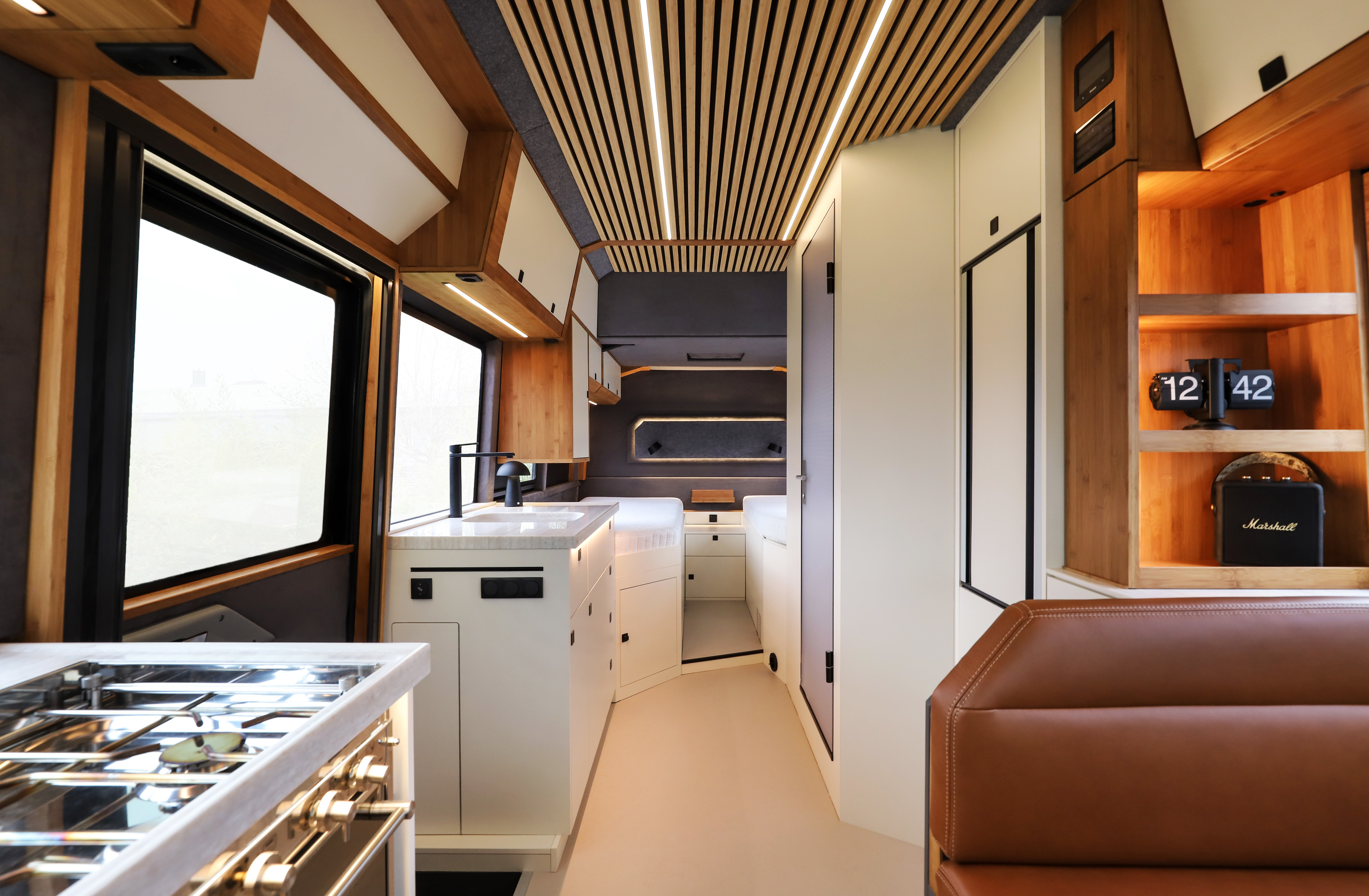 Inside the Torsus Praetorian Liberra camper, with the galley kitchen at left
