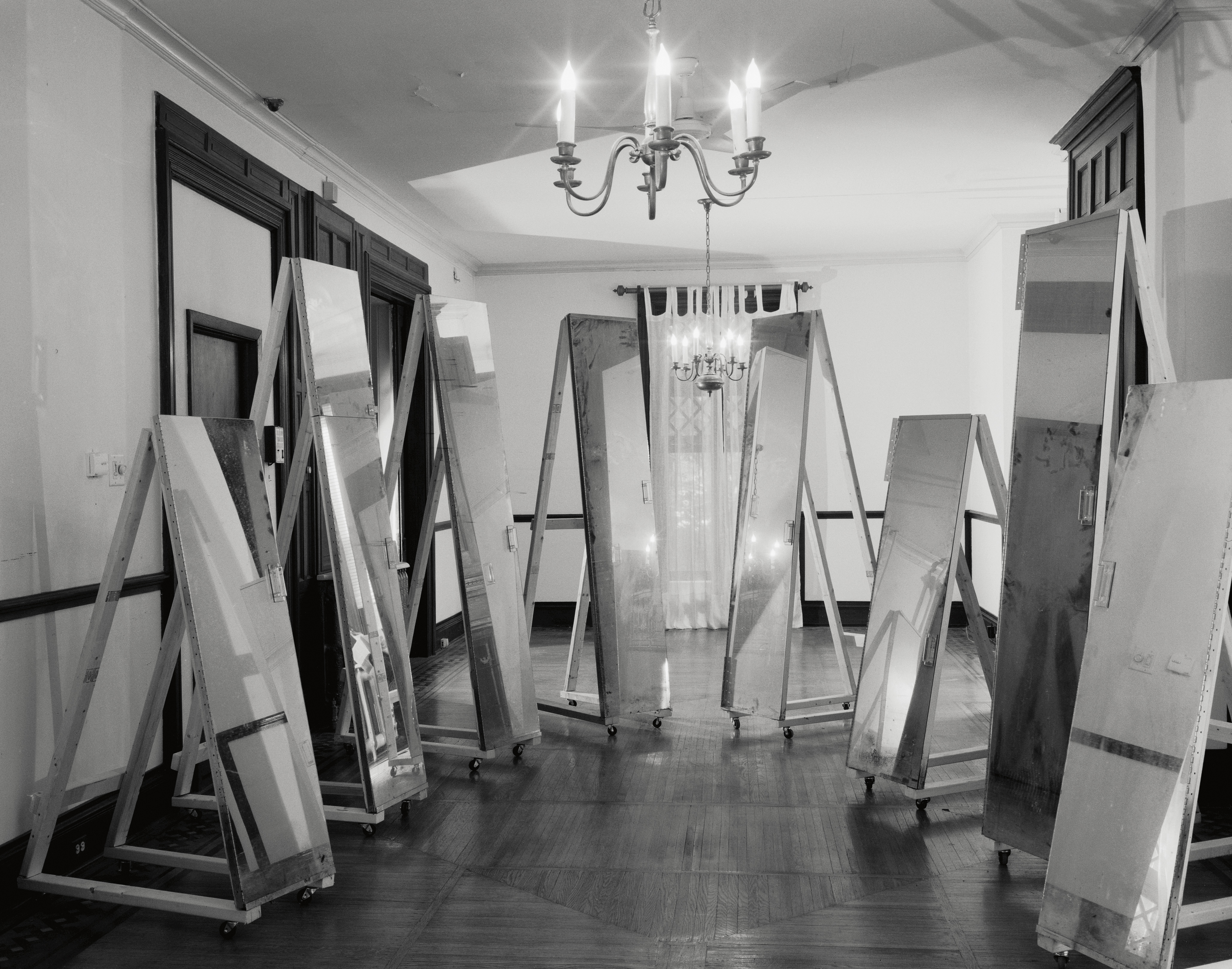 black and white images of an elderly woman in her house