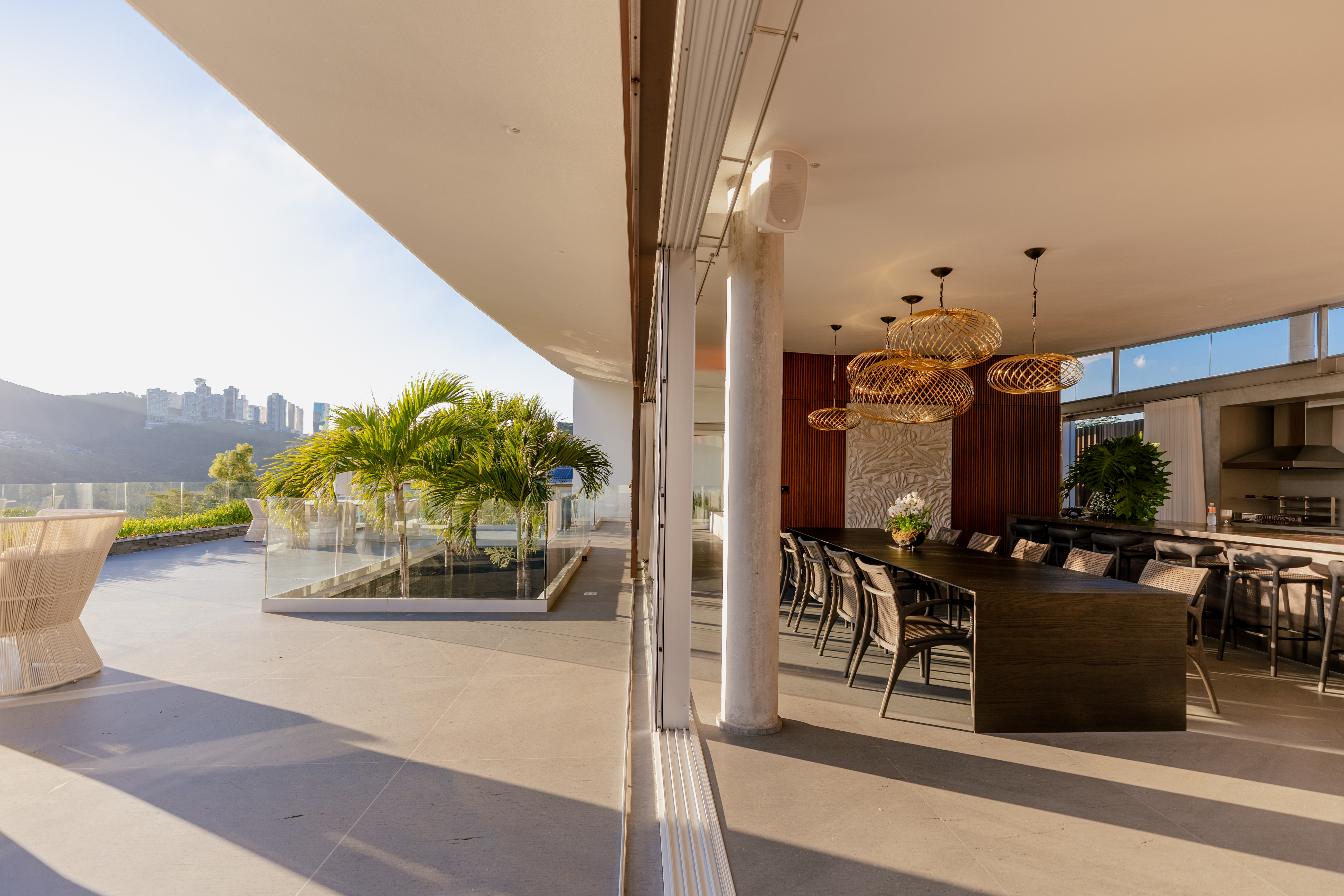 The main living spaces open up to the expansive terrace