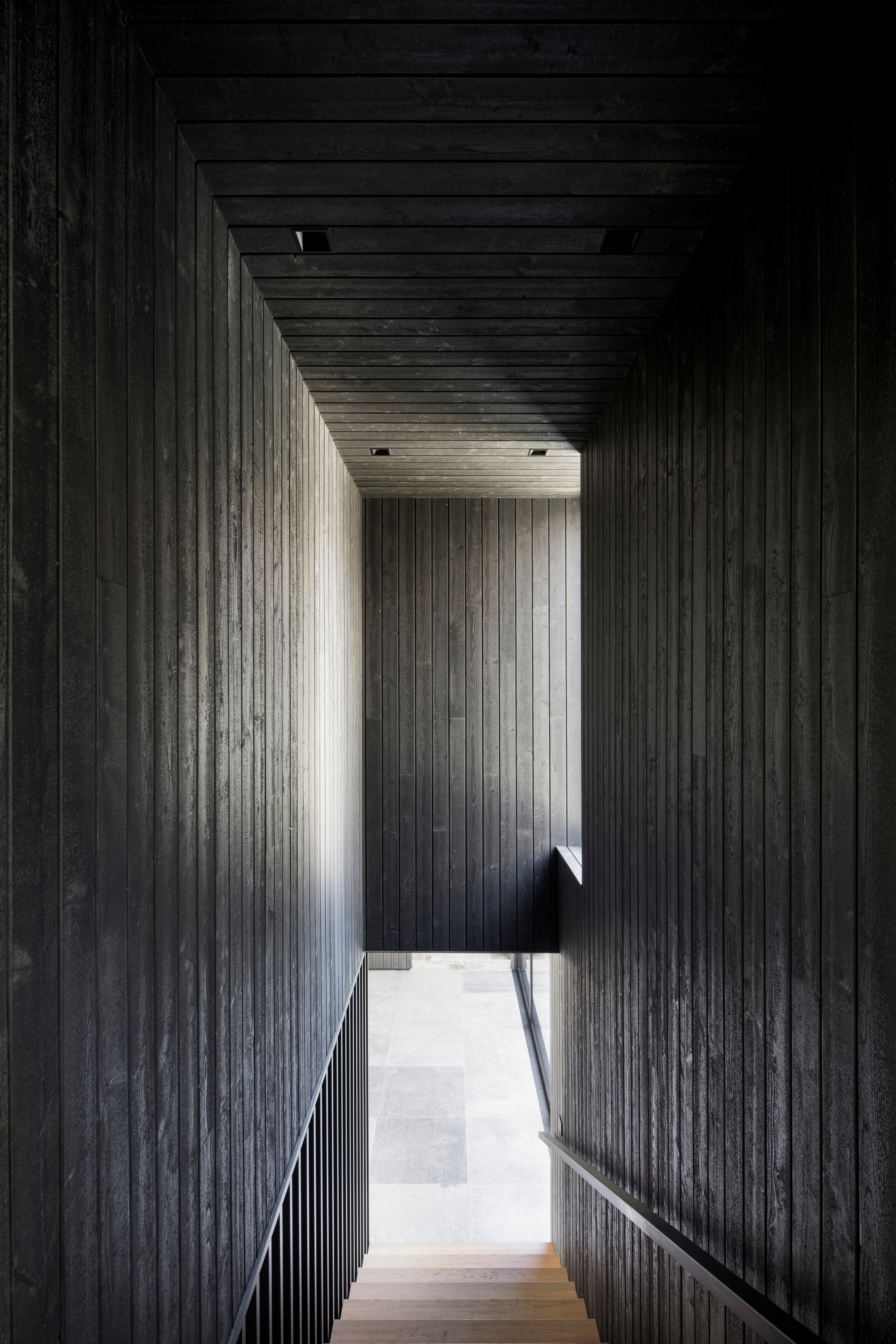 An upper level above the children's wing houses a guest suite and office space