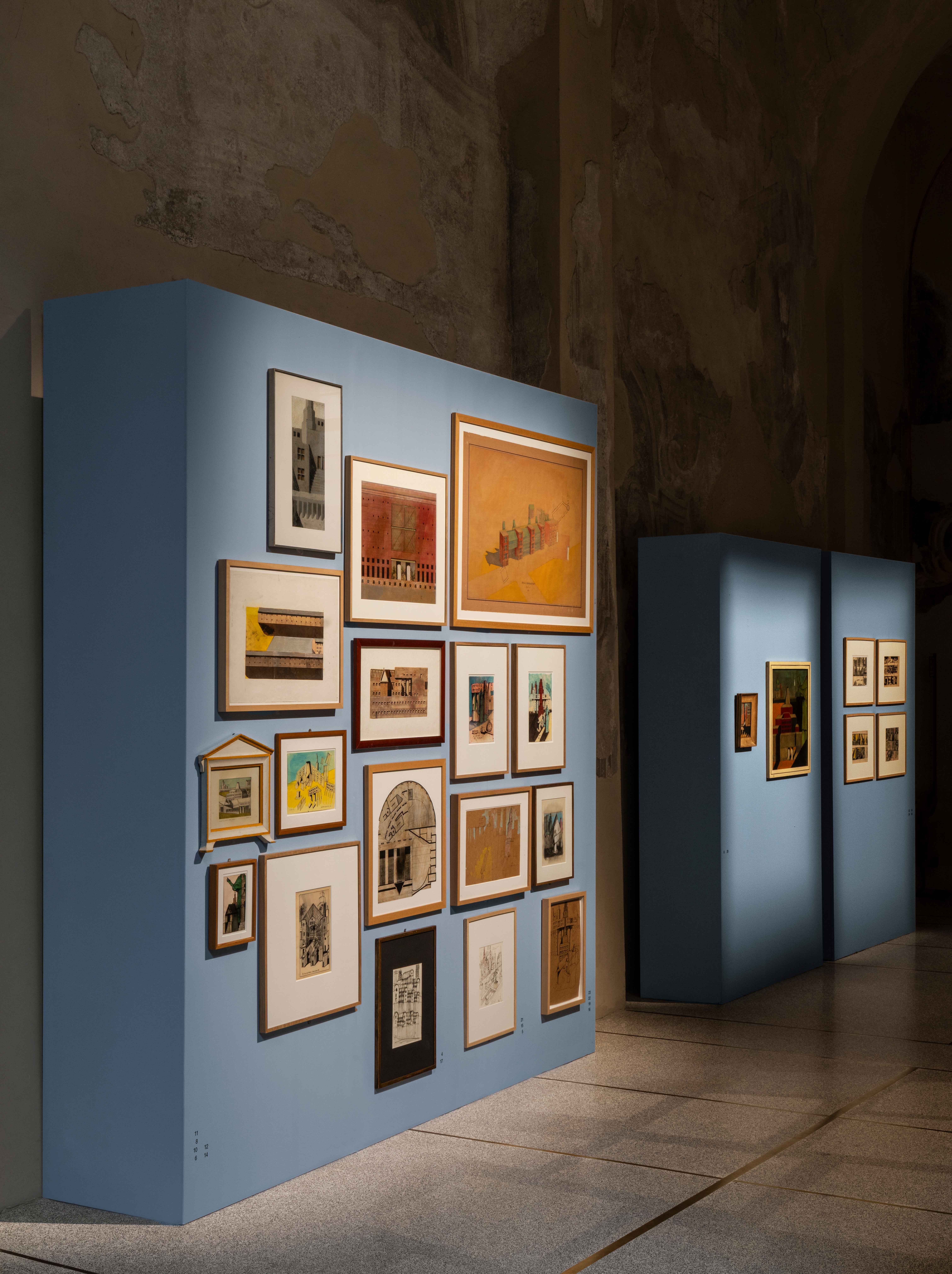 Antique Italian church with blue partitions to show framed drawings by architect Aldo Rossi