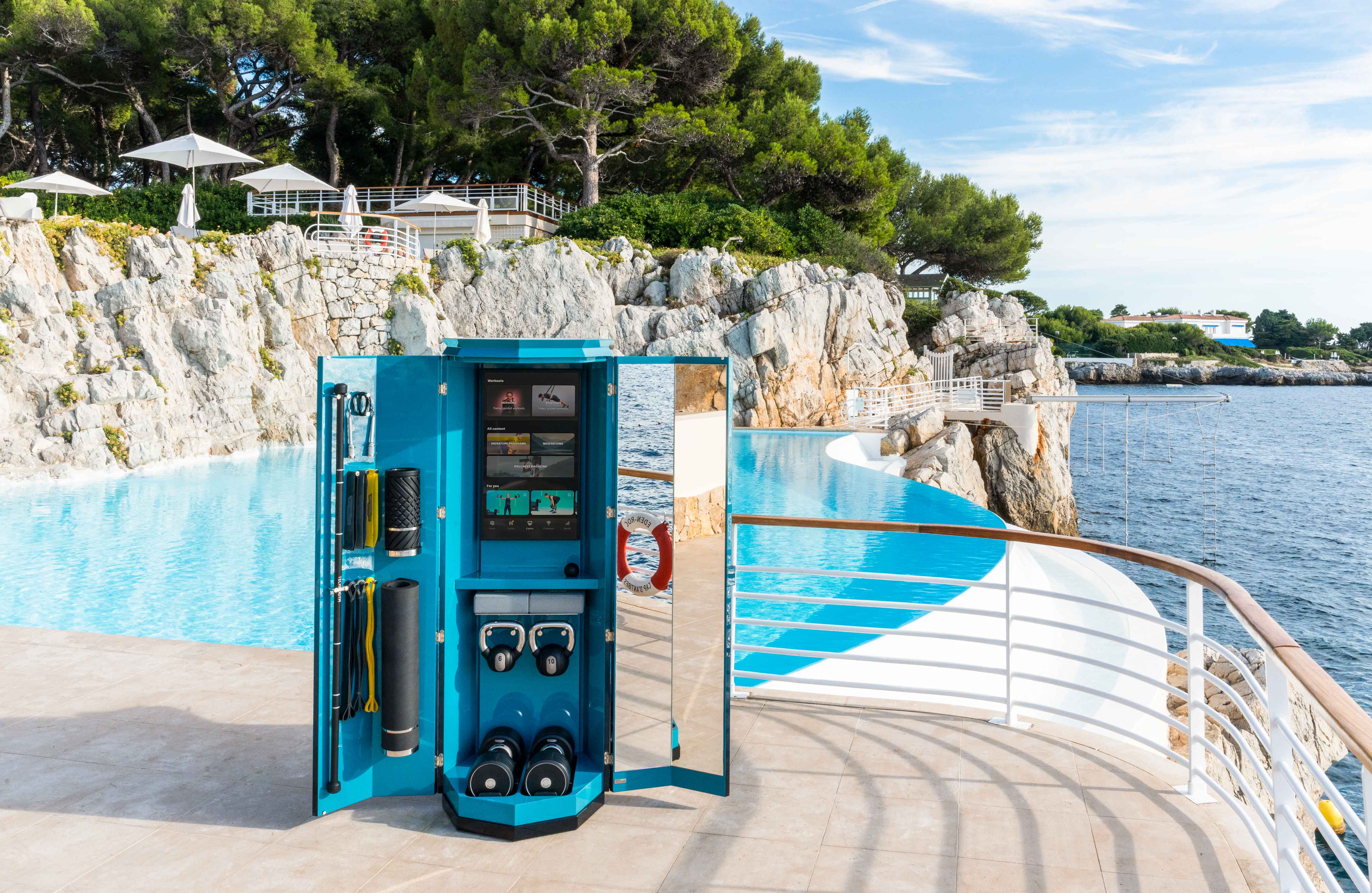 Octagon-shaped gym cabinet by Cassina with Technogym, photographed on the pool terrace by the sea at Hotel du Cap Eden Roc