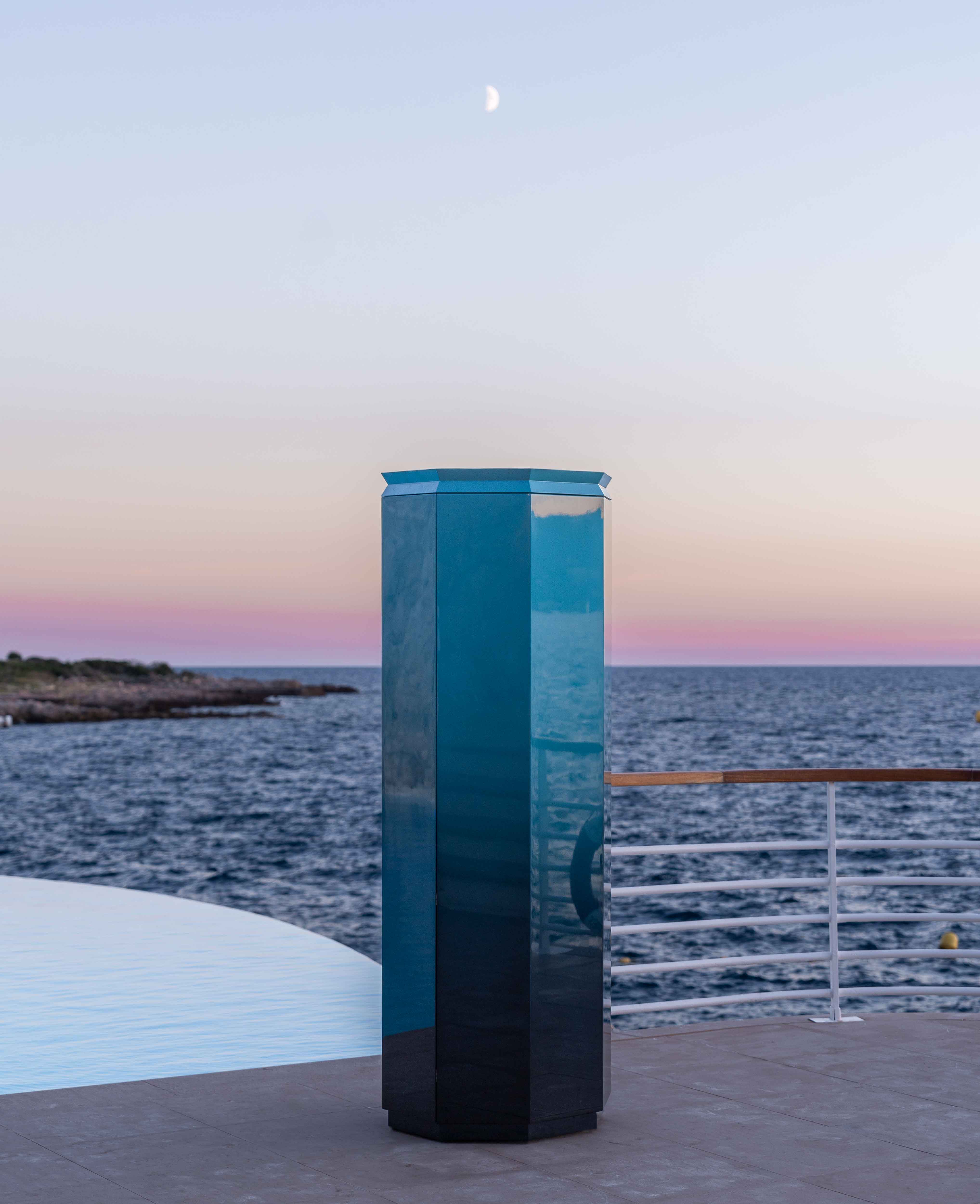 Octagon-shaped compact gym equipment cabinet in blue by Cassina with Technogym equipment