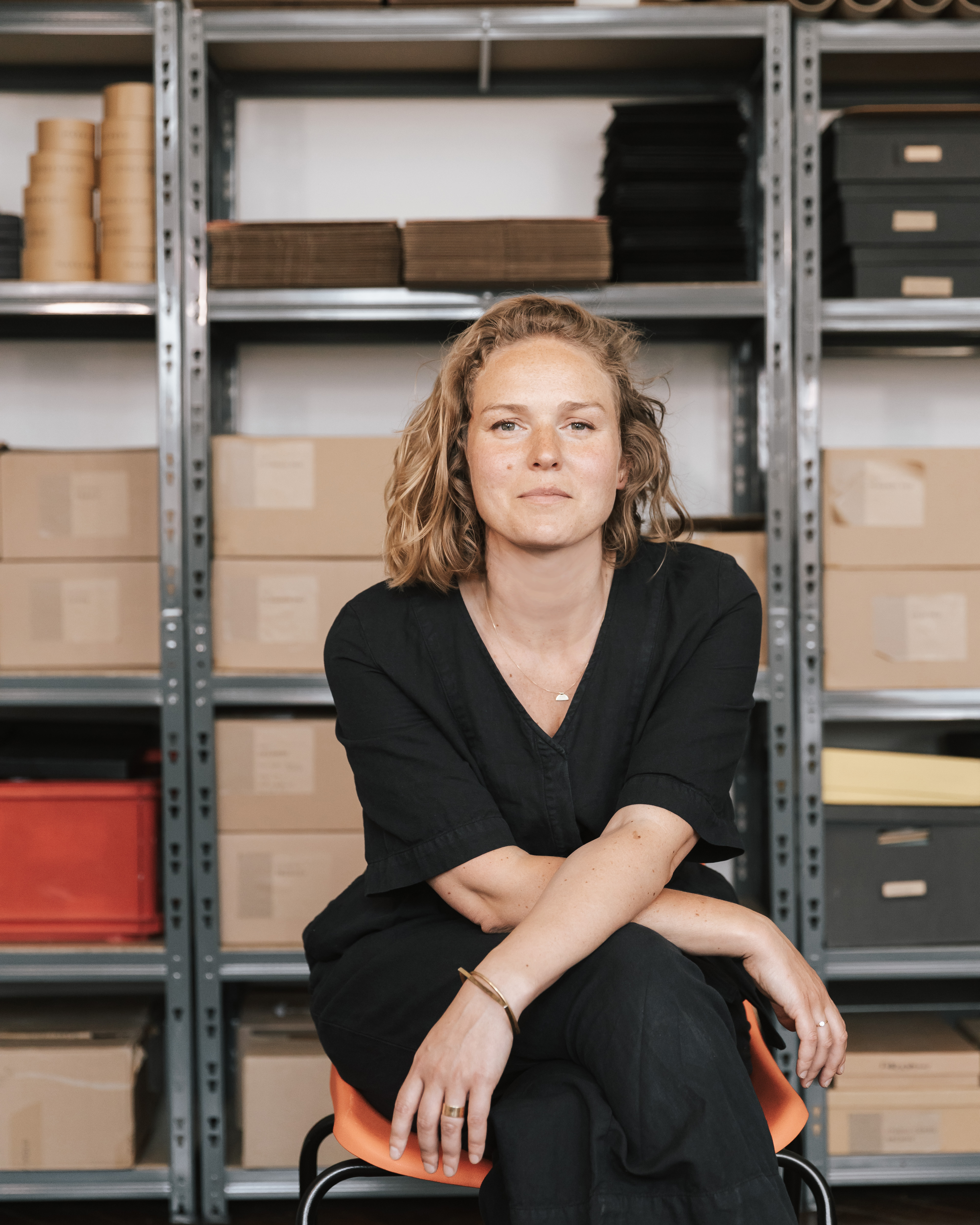 Amy Cooper-Wright sitting on stool