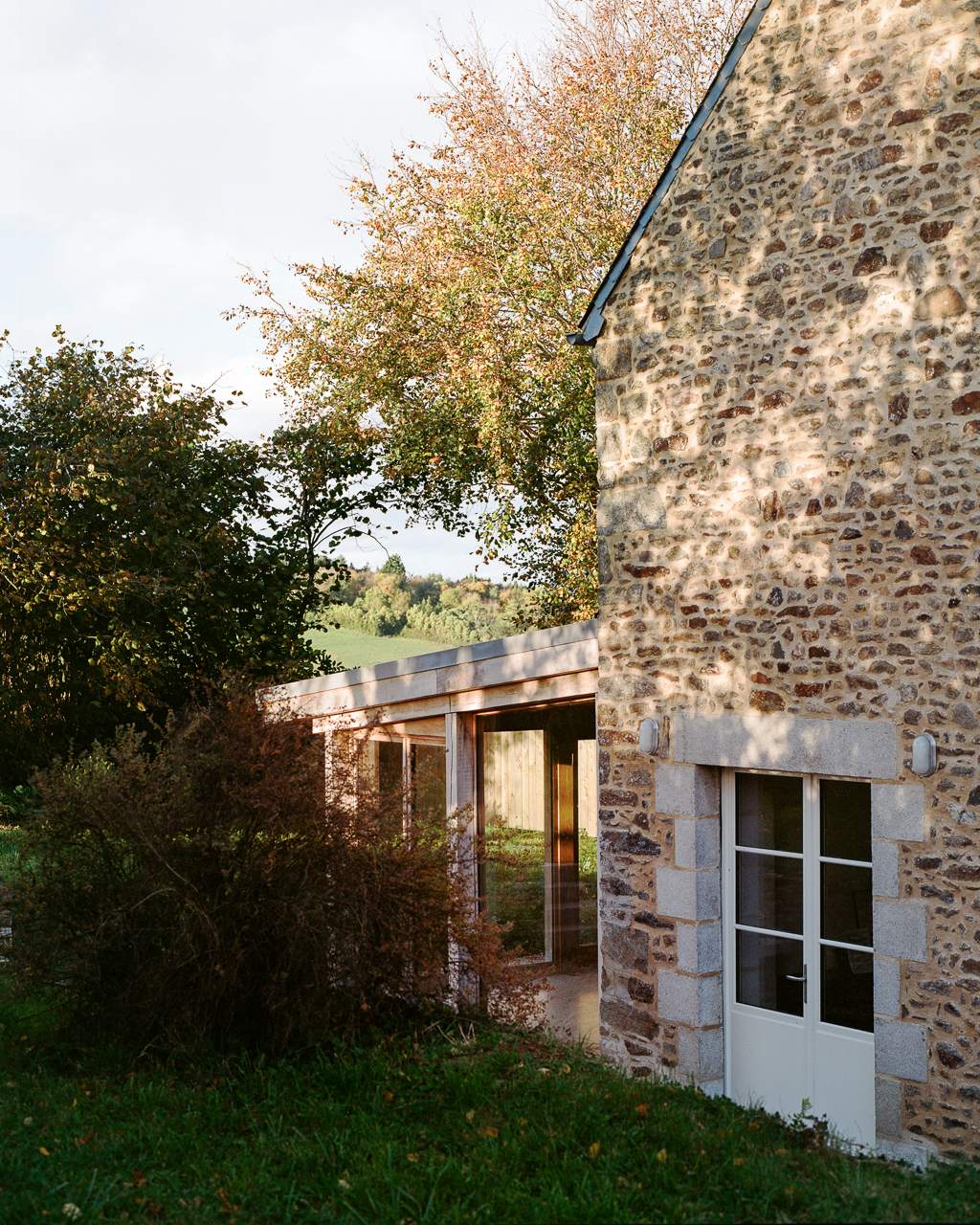 The new extension blends well with the existing stone house