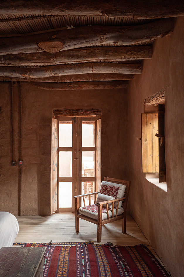 views of mud brick house with warm hues in desert building style, Bin Nouh's Courtyard House by Shahira Fahmy