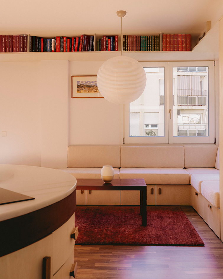 interior views of warm Barcelona apartment in red and neutral tones