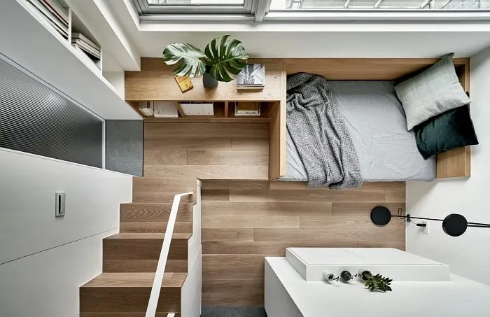 Cozy small studio apartment mezzanine view with sleeping area